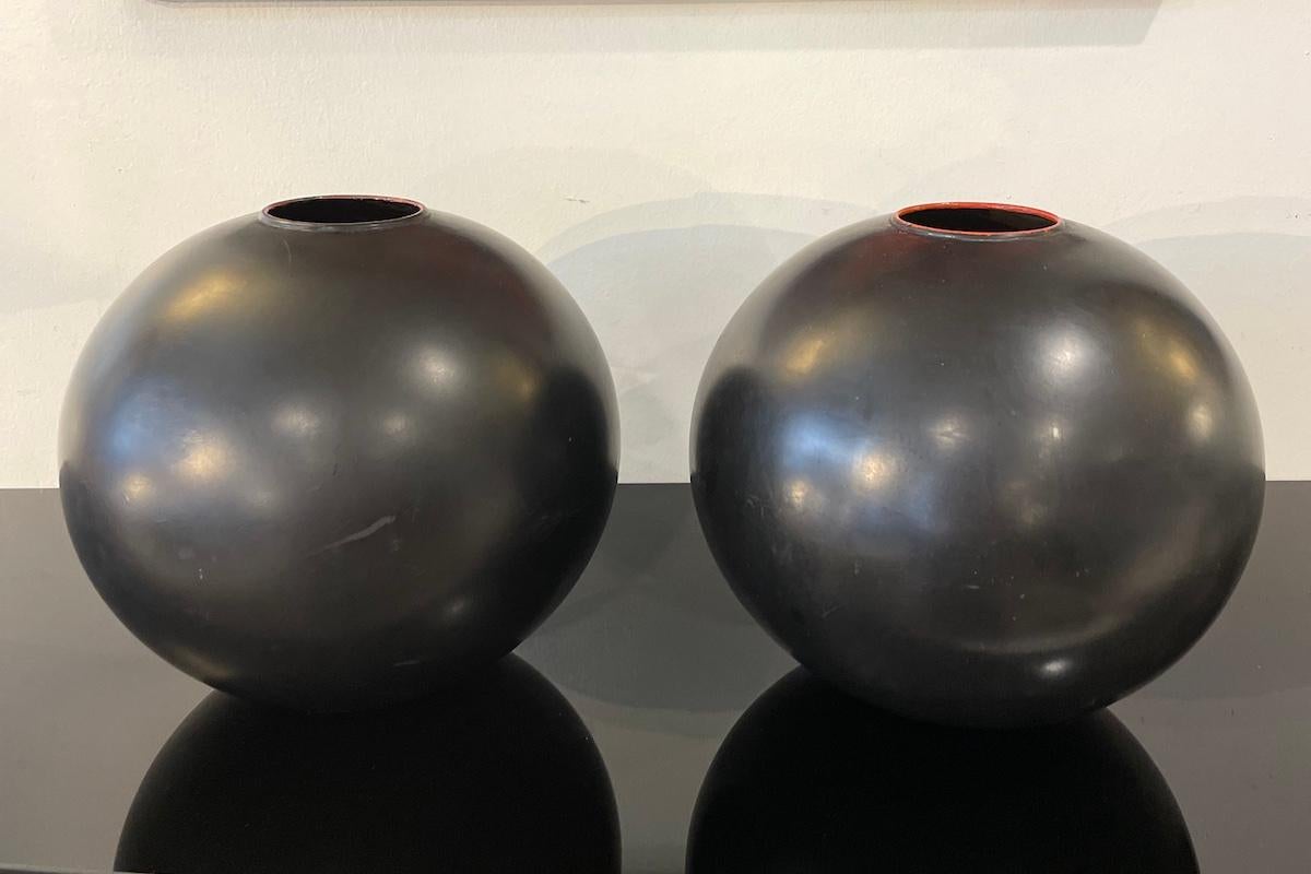 Japanese vase in black metal with a spherical shape. Available individually or as a pair with an identical piece. 
Price: €925 each. 
Measurements: diam. 28 × h 27 cm.

Price INCLUDES the costs for any packaging and crates needed to protect the item