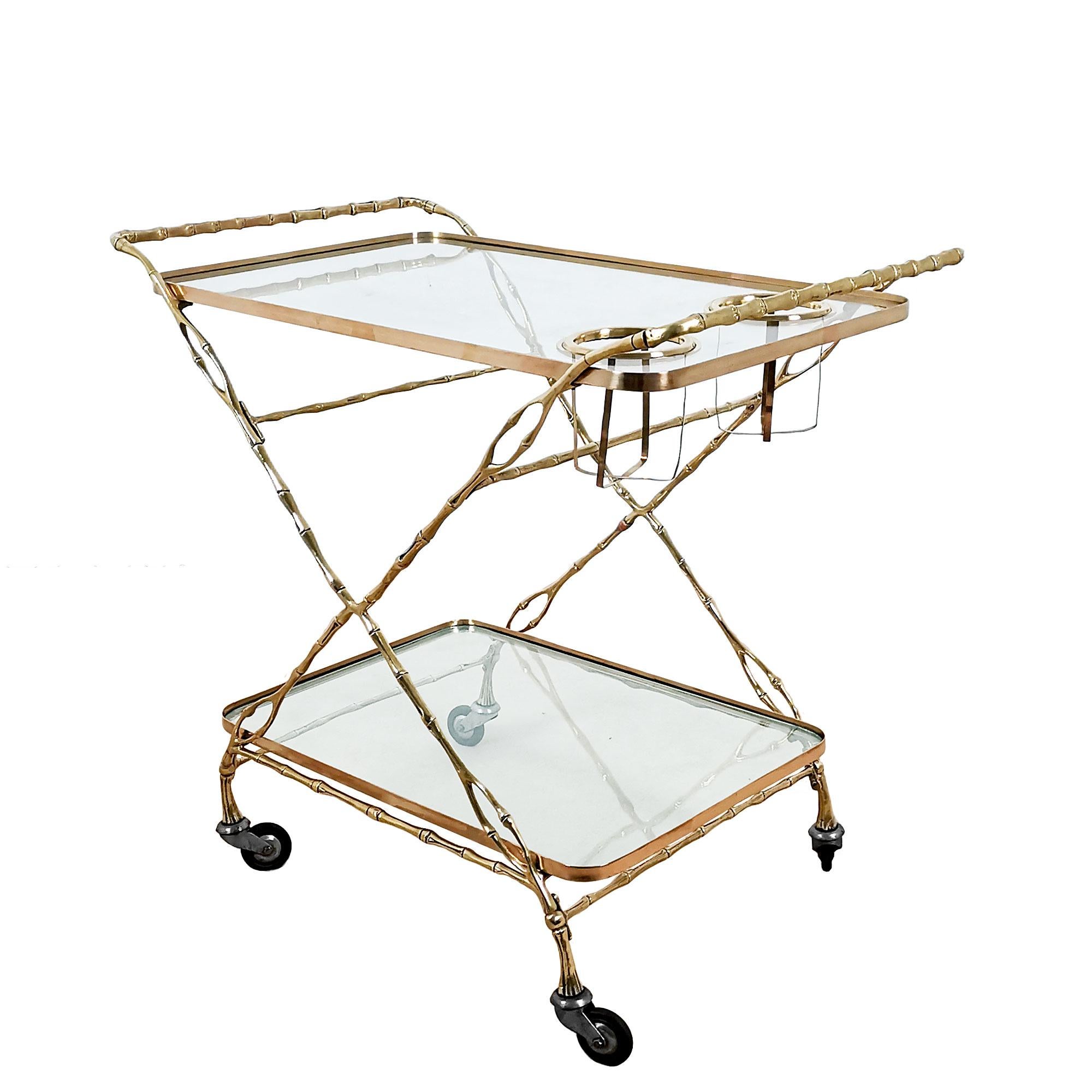Bar cart with wheels, two levels in solid brass and glass, high quality. In the style of Maison Baguès.
Spain, Barcelona c. 1960.