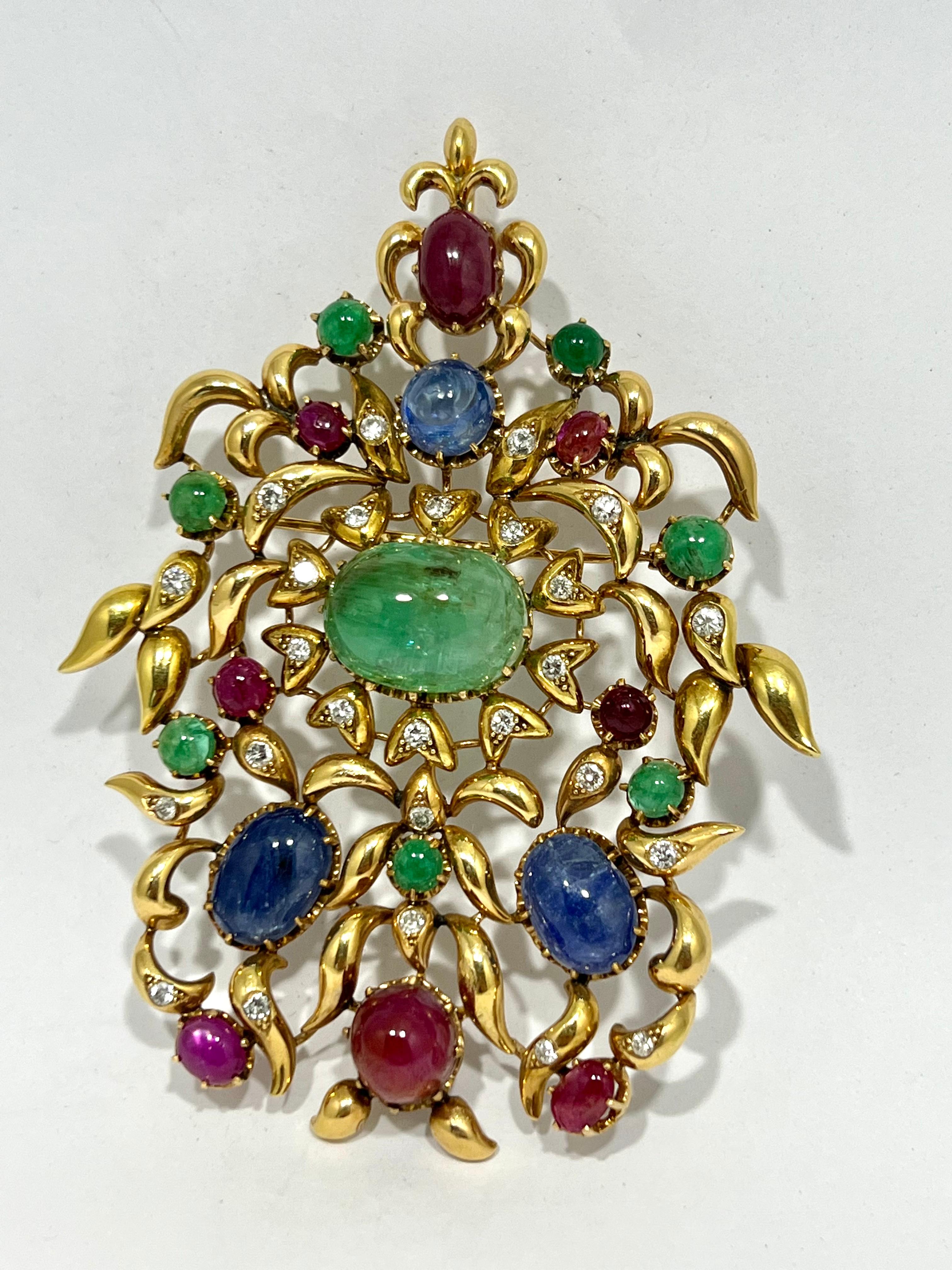 1960´s Bouquet Brooche & pendant in 18k Gold Emerald Ruby & Sapphire Cabochons
All natural gems
Emeralds 8 cabouchon total 10cts
Sapphires 3 cabouchon total 7 cts
Rubies 8 cabouchon total 6cts 
Diamonds brilliant cut 1.50cts 

MATERIALS
◘ Weight 65