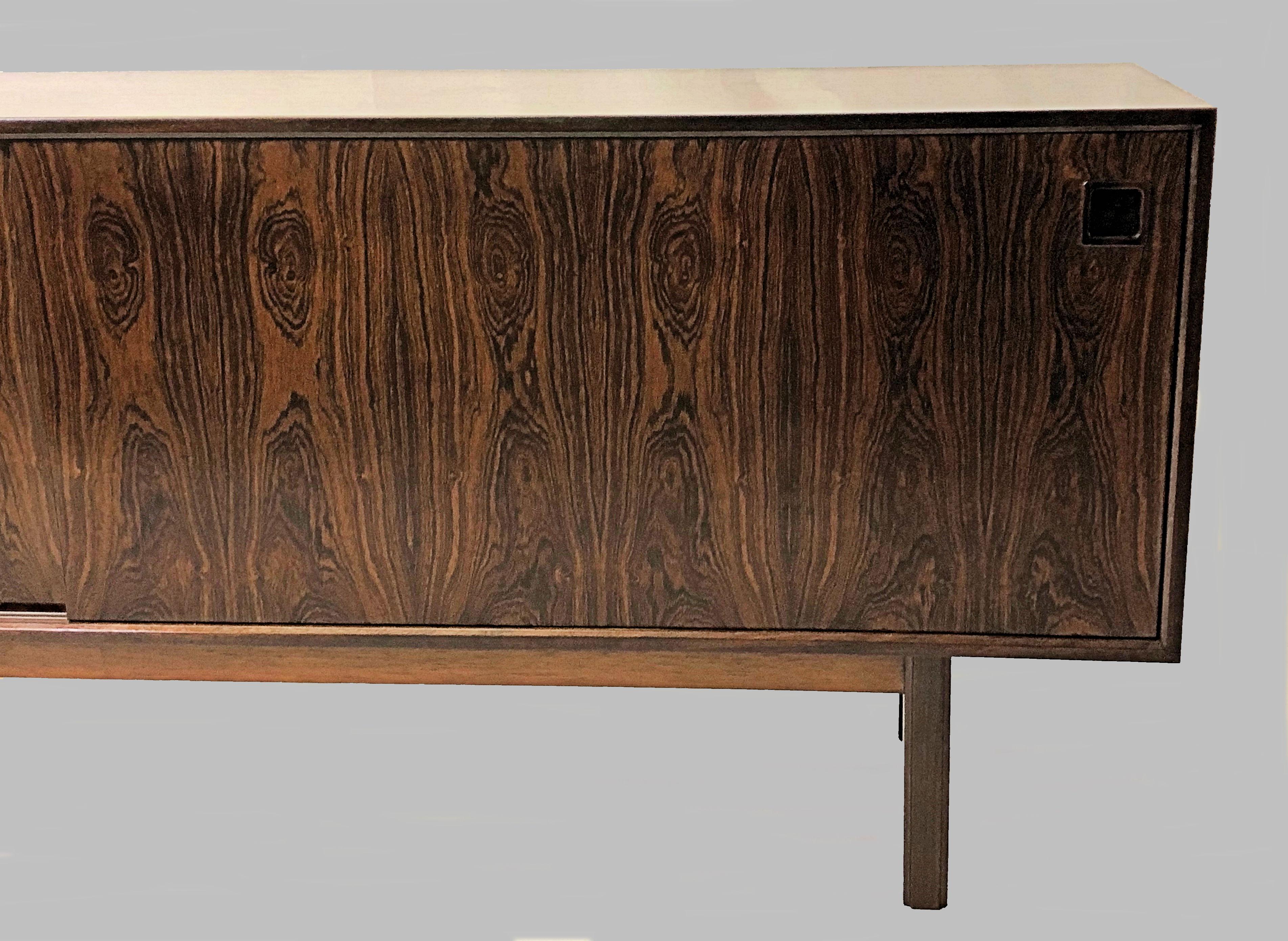 Spacious 1960s sideboard in rosewood designed and produced by Omann Jun.

The sideboard has been owned by the same owner since the 1960s and is in very good condition.
 