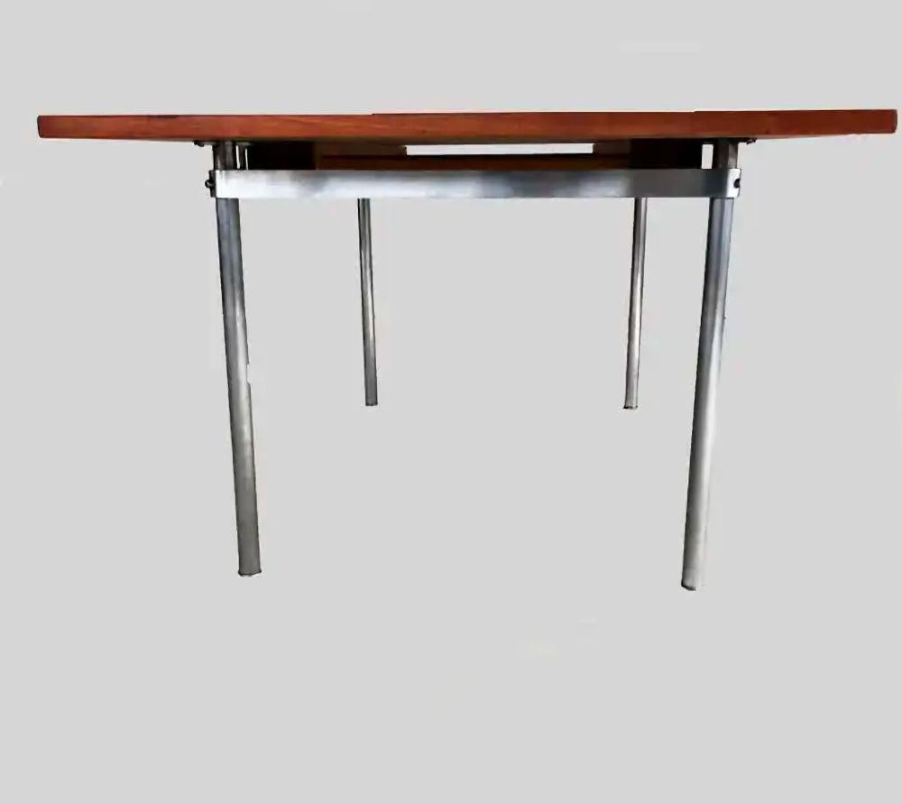 1960´s Hans Wegner fully restored extension dining table in teak by Andreas Tuck 

The well designed and very well crafted rectangular rich grained teak tabletop with two integrated leaves on top of the satin-chromed steel pipe legs has been fully