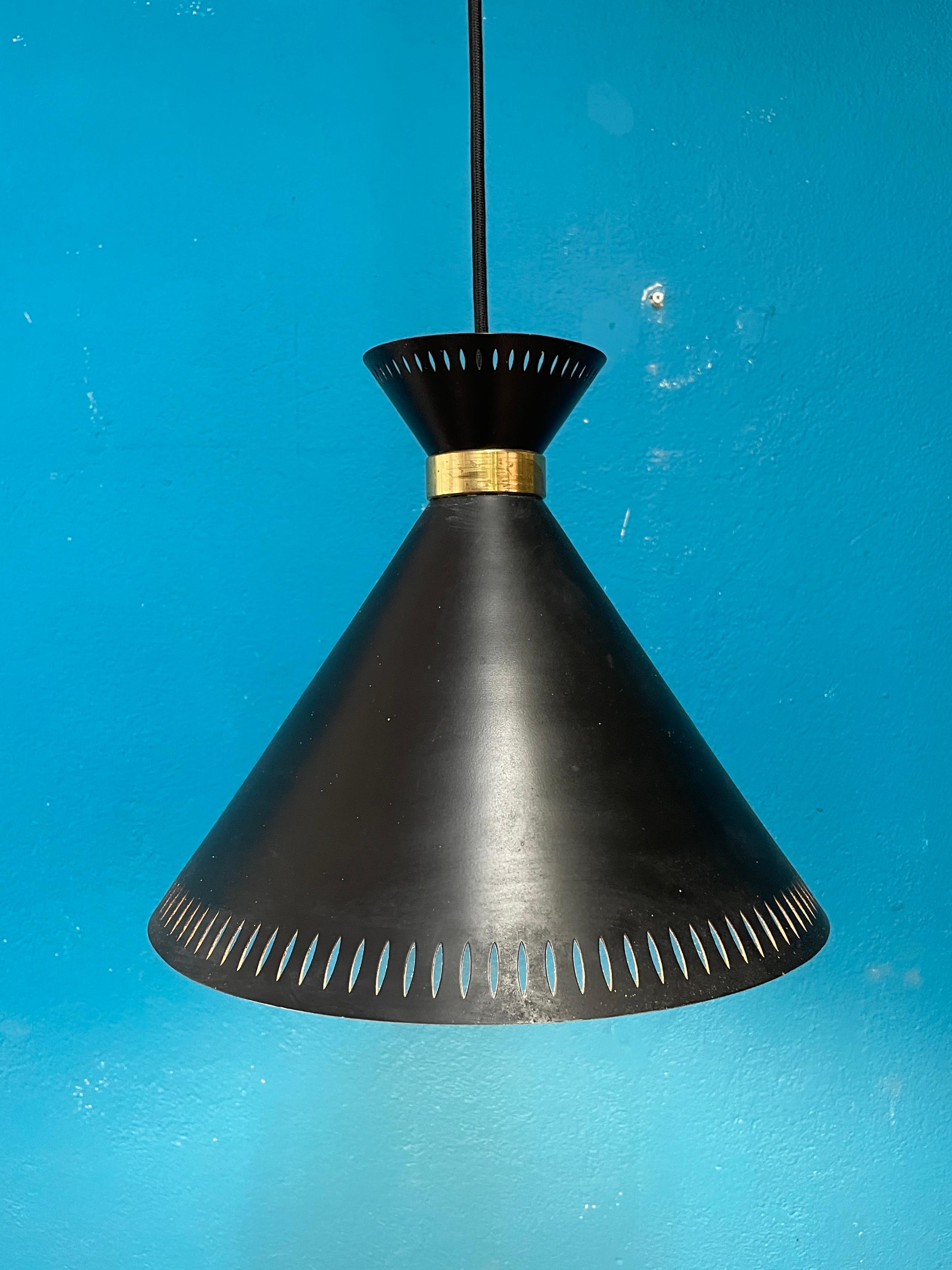 Beautiful Black colored pendant by Valinte Finland. Pierced shade with white inner surface and brass detail. The design has clearly been influenced by Paavo Tynell and Tapio Wirkkala designs. Designer of this lamp is unknown.

New Wires, length of