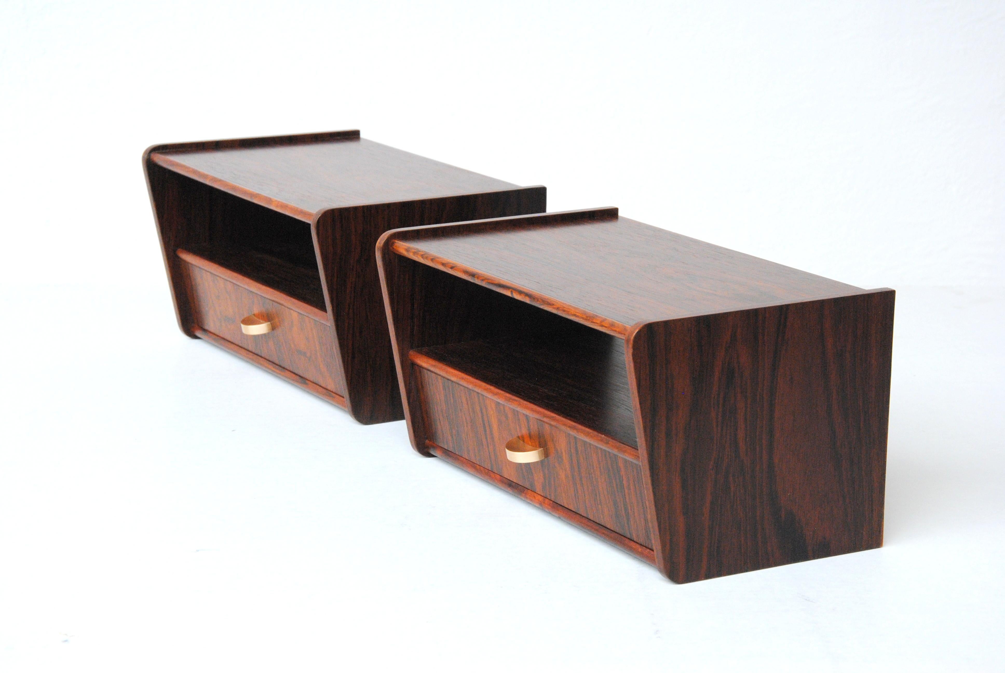 Set of two restored Danish floating rosewood nightstands from the 1950´s - 1960´s

The nightstands are examples of the minimalistic and functional yet beautiful design and advanced craftmanship that characterized Danish mid-Century Furniture.