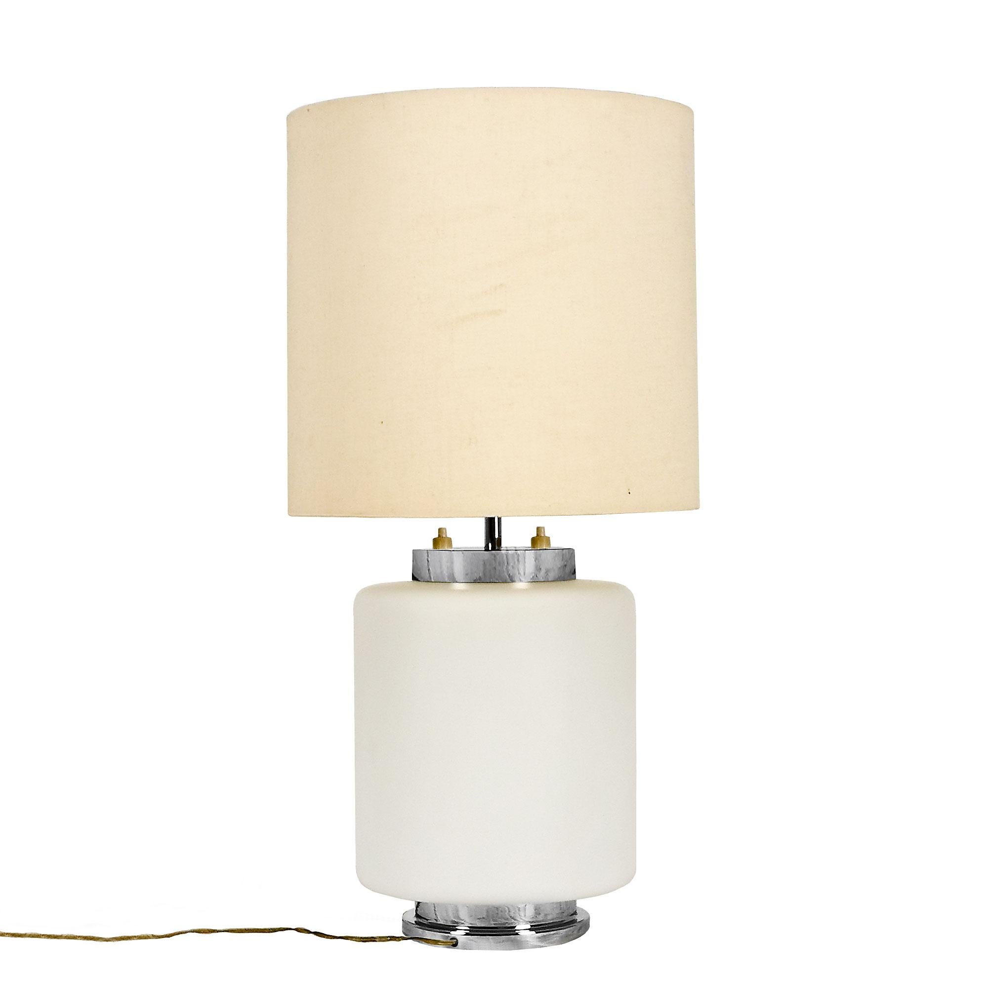 Table lamp, translucent opaline and chrome plated metal, double lightning system. Original beige fabric lampshade.

Italy c. 1960.