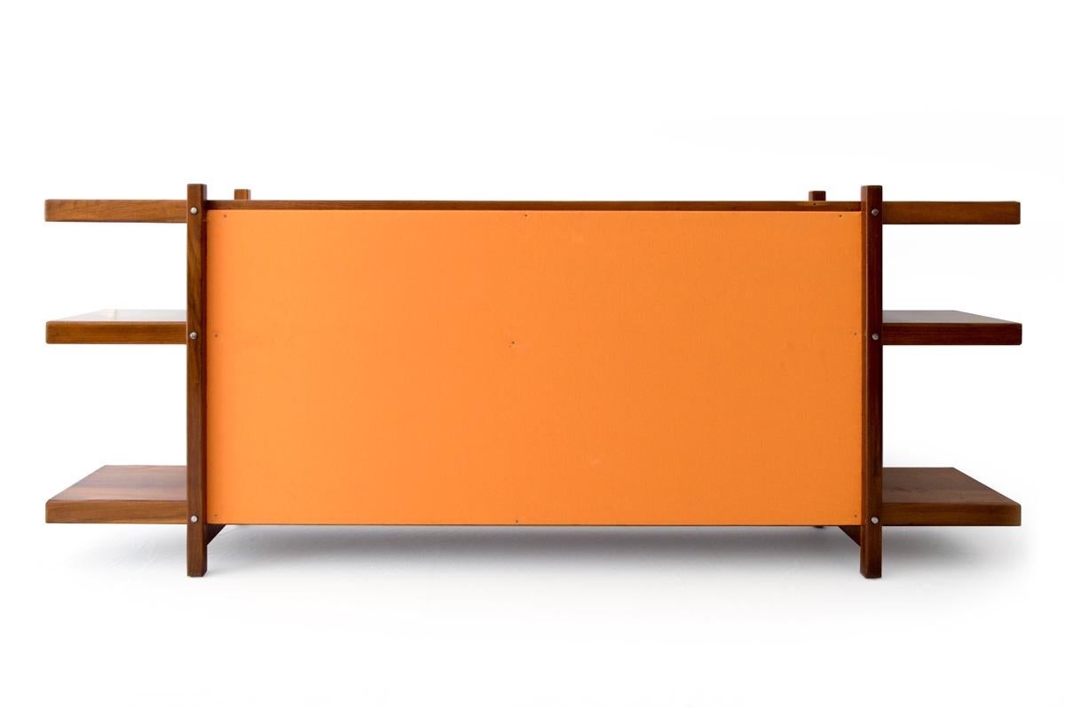 The solid hardwood frame with hardwood veneer shelves and the plywood back fabric-upholstered.

Literature:

Sérgio Rodrigues, Banco Icatu , Soraia Cals p. 263.