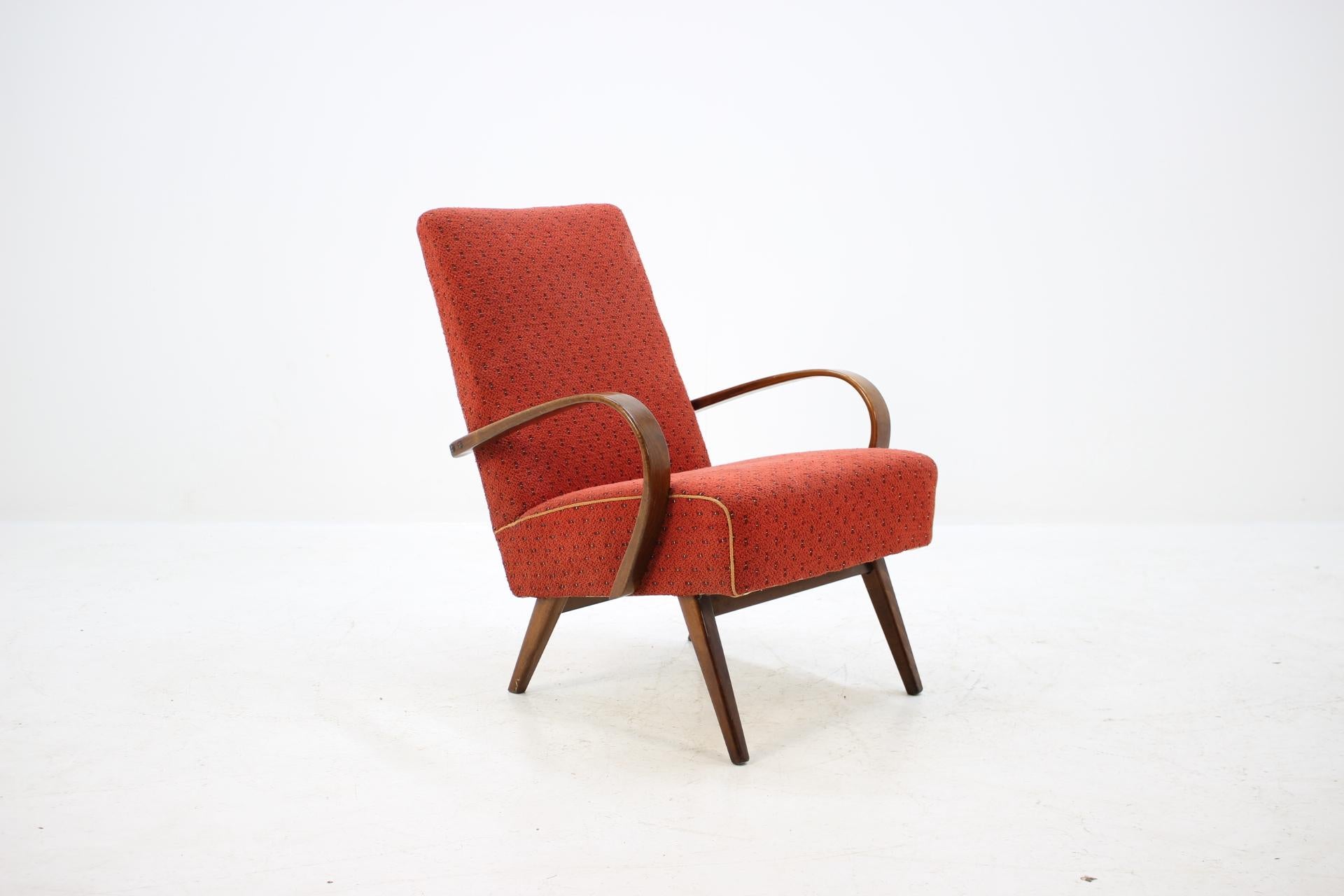 This chair was made in Czech Republic during 1960s by Thon company (before Thonet). Legs and bentwood armrests are made from beech wood and have been re-polished. Good original fabric upholstery with no holes.