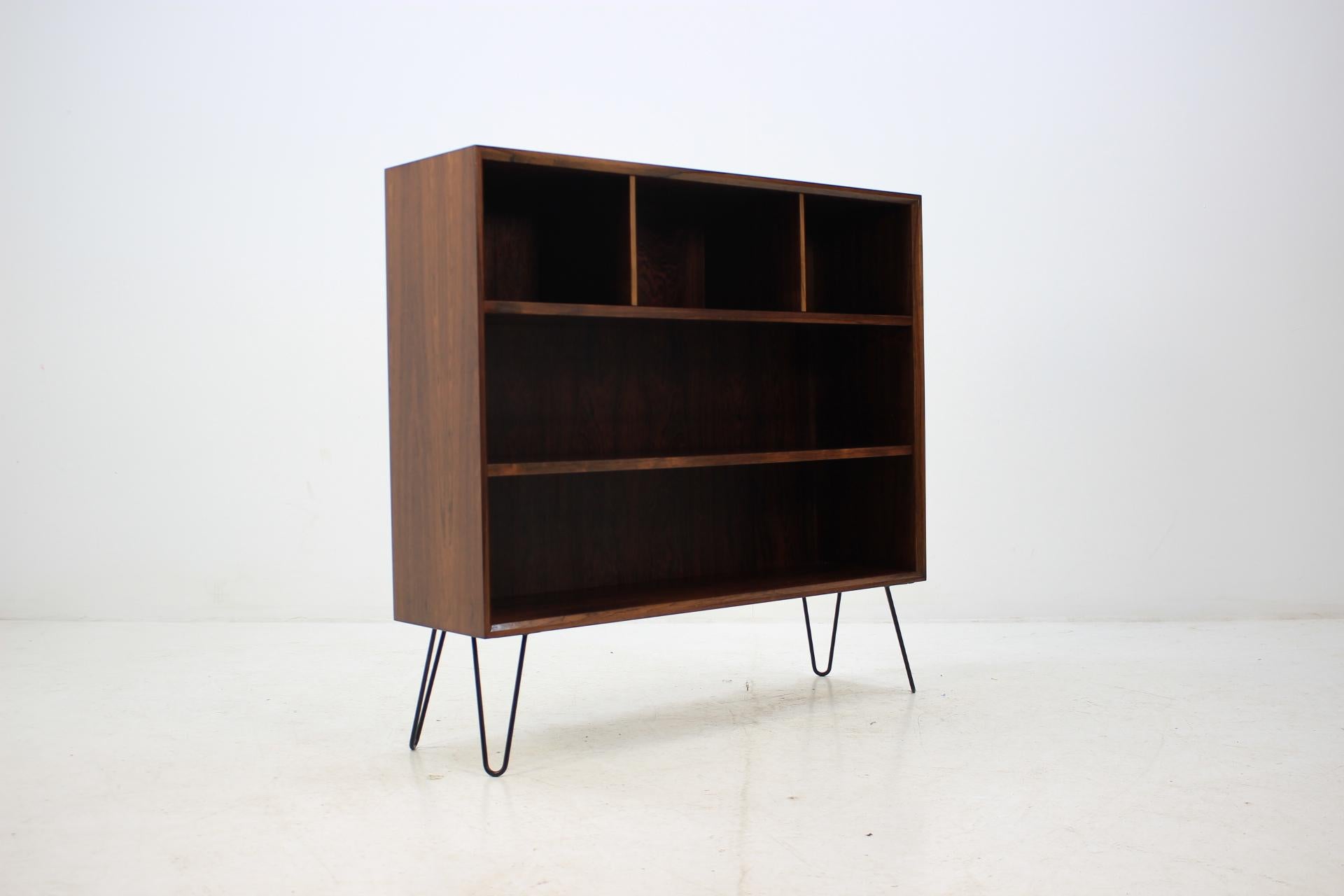 This bookcase was carefully restored. The hairpin iron legs were added afterwards.