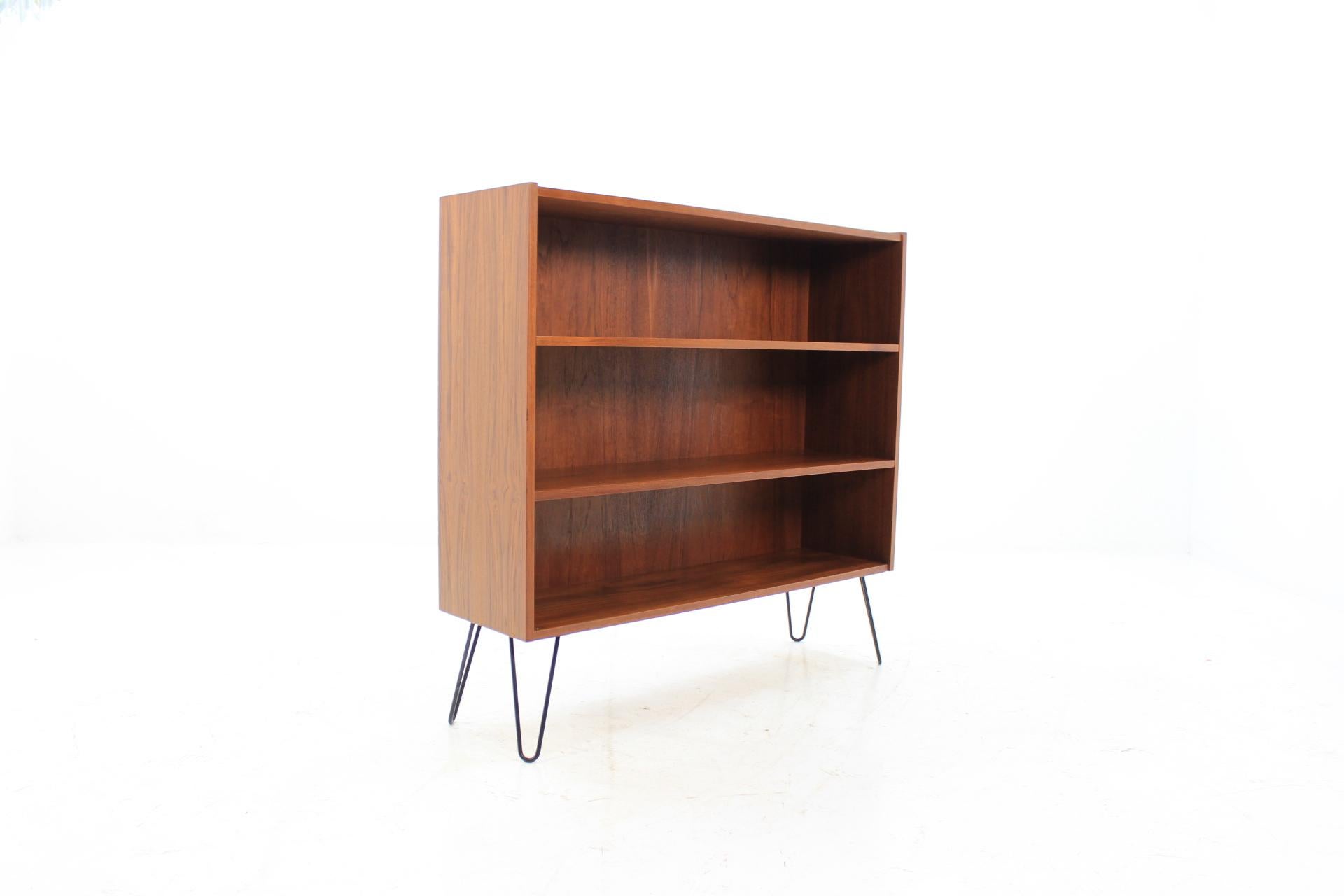 This bookcase was carefully restored. The hairpin iron legs were added afterwards.