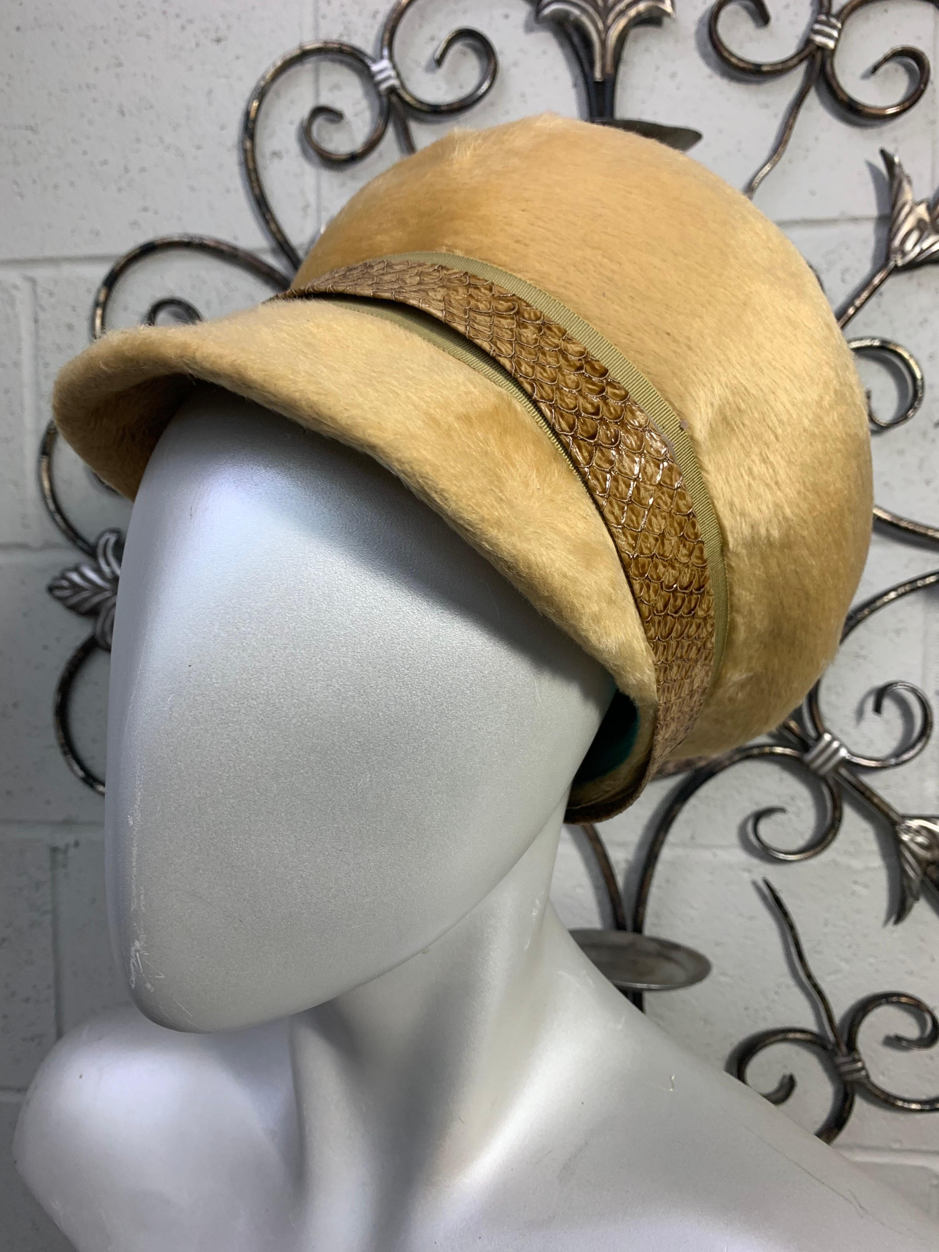 A super 1960s Yves Saint Laurent tan long-nap fur felt Mod newsboy-style hat with a small front brim and a wide buckle-closure hatband in faux snakeskin. Signature blue grosgrain inner band. Size M.