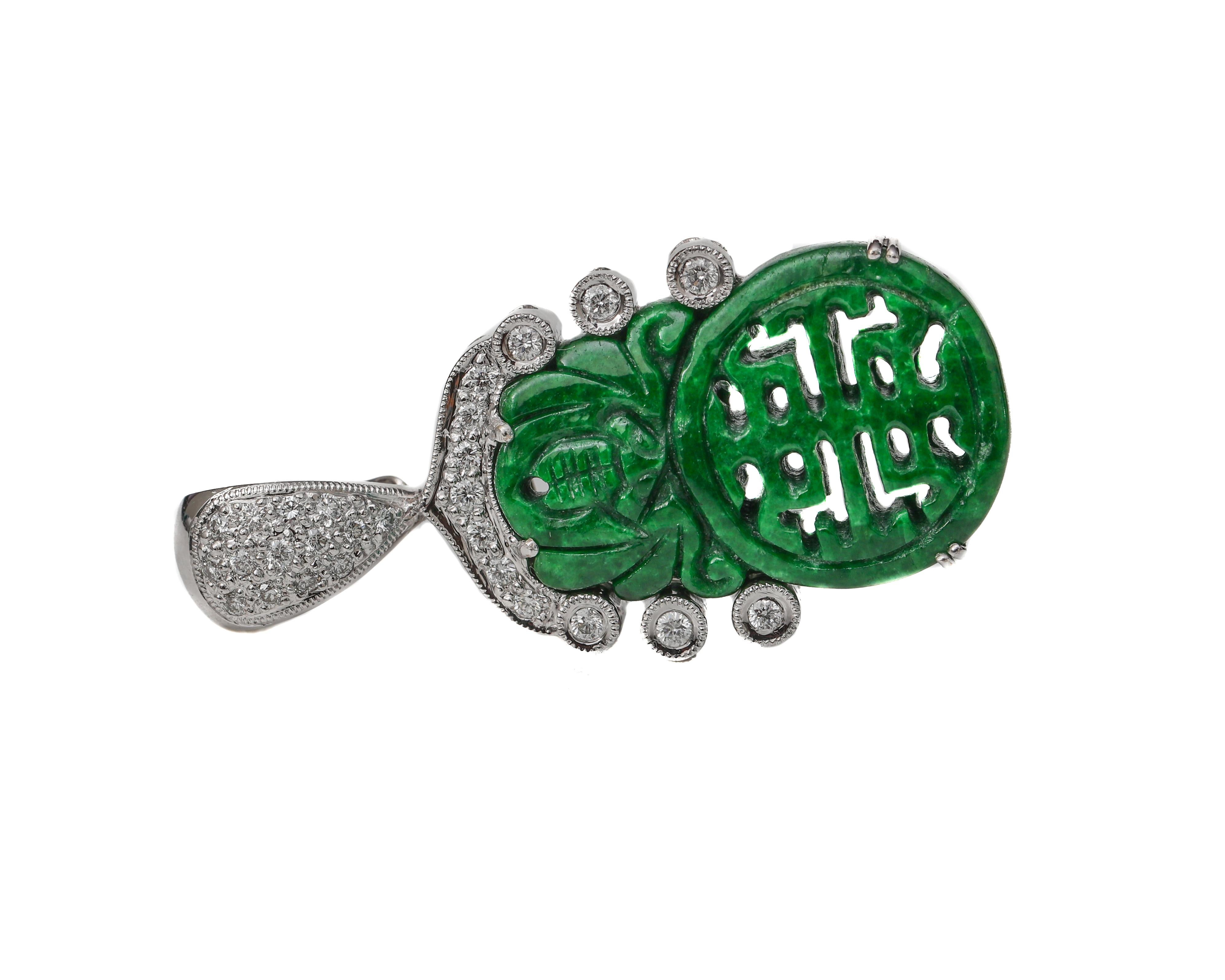 Beautiful 18 karat white gold Scarab Jade pendant with half a carat of diamonds that sparkle and dazzle from afar!

Pendant details:
Metal: 18 karat white gold 
Weight: 11.53 grams
Measurements: 40 millimeter x 20 millimeter 

Diamond Details:
Cut: