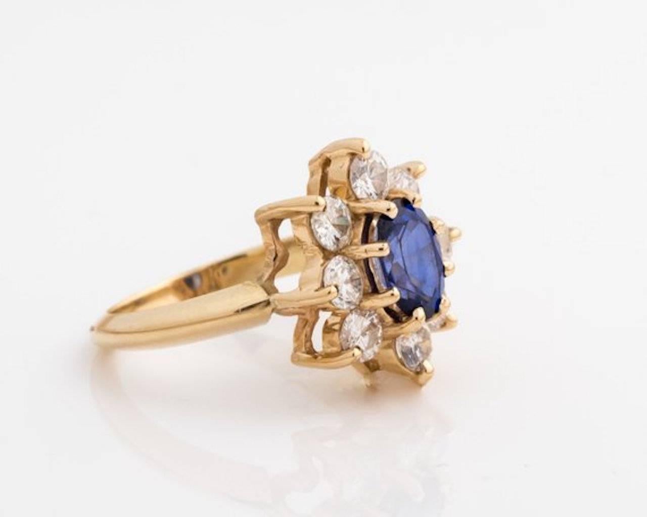 1960s Retro Sapphire, Diamond Halo Ring - 14k Yellow Gold, Sapphire, Diamonds

Features an 8-prong set, oval Sapphire with a Diamond halo. 
The elevated center stone is framed by a 1.0 carat total weight Diamond halo. The Diamonds are set at