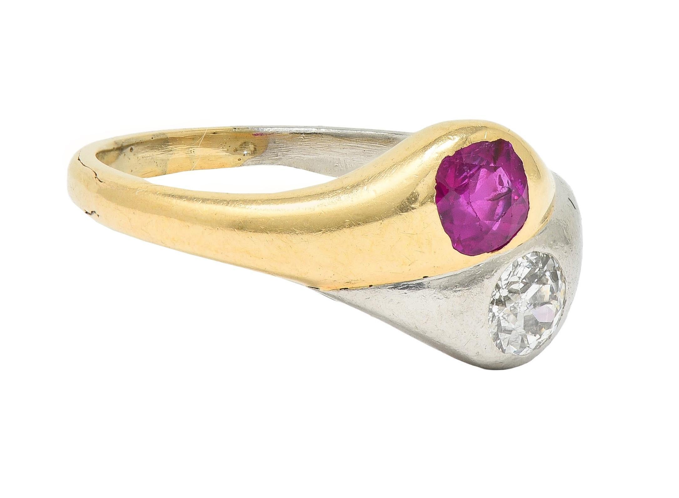 Designed as a toi-et-moi style ring with one half platinum and one half yellow gold
Centering a flush set cushion cut ruby and a flush set old European cut diamond
Ruby weighs approximately 0.65 carat - transparent medium red in color 
Diamond