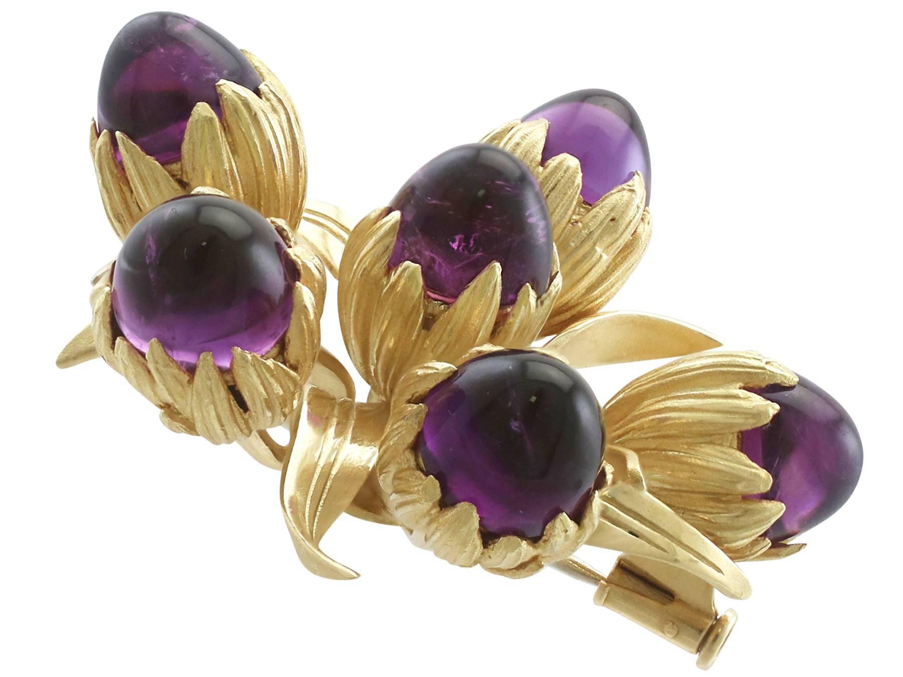 A stunning vintage 1960's 11.20 carat amethyst and 18 karat yellow gold floral brooch; part of our diverse gemstone jewelry and estate jewelry collections.

This stunning, fine and impressive amethyst brooch has been crafted in 18k yellow gold.

The