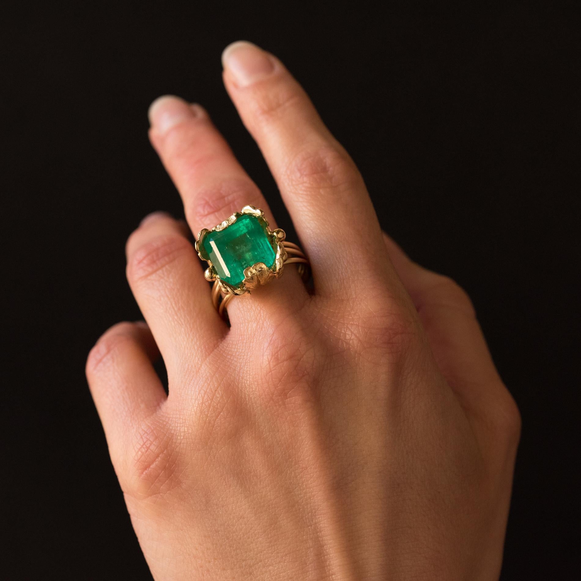 Emerald Cut 1960s 11.76 Carat Colombian Emerald Foliaged Setting 18 Karat Yellow Gold Ring