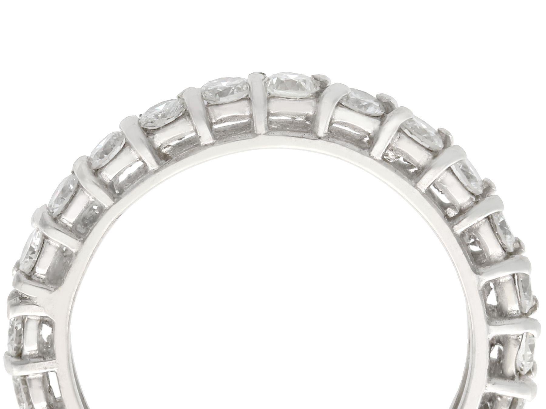 A fine and impressive vintage 1.20 carat diamond, 18 karat white gold full eternity ring; part of our vintage jewelry/estate jewelry collections

This impressive vintage full eternity diamond ring has been crafted in 18k white gold.

The pierced