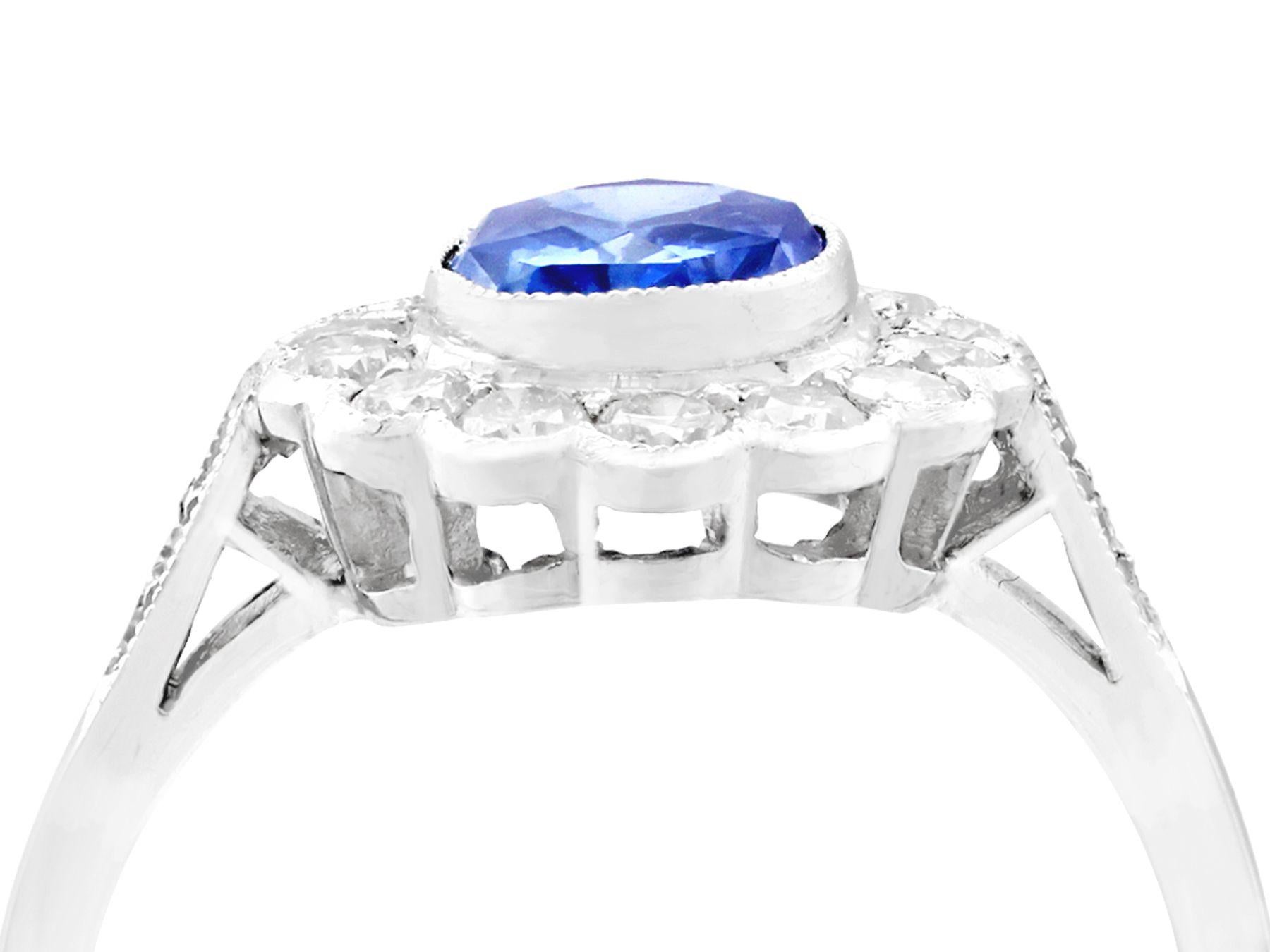 A stunning, fine and impressive 1.29 Carat blue sapphire, 0.56 Carat diamond, and platinum dress ring; part of our diverse vintage jewelry collections.

This stunning, fine and impressive sapphire cluster ring has been crafted in platinum.

The