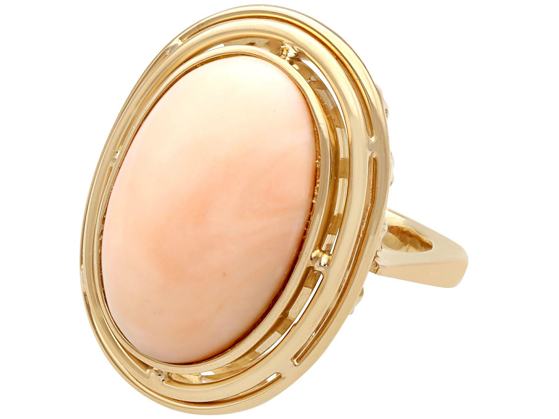 Oval Cut 1960s 13.98 Carat Cabochon Cut Coral and Yellow Gold Cocktail Ring For Sale