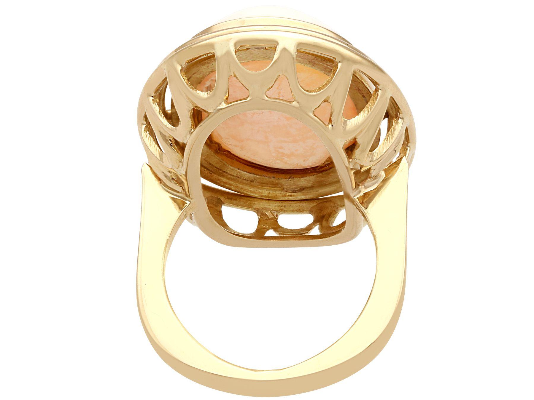 Oval Cut 1960s 13.98 Carat Cabochon Cut Coral and Yellow Gold Cocktail Ring For Sale