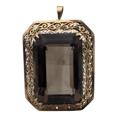 1960s, 14 Karat yellow gold, 77.65 carat smoky topaz filigree pendant or pin