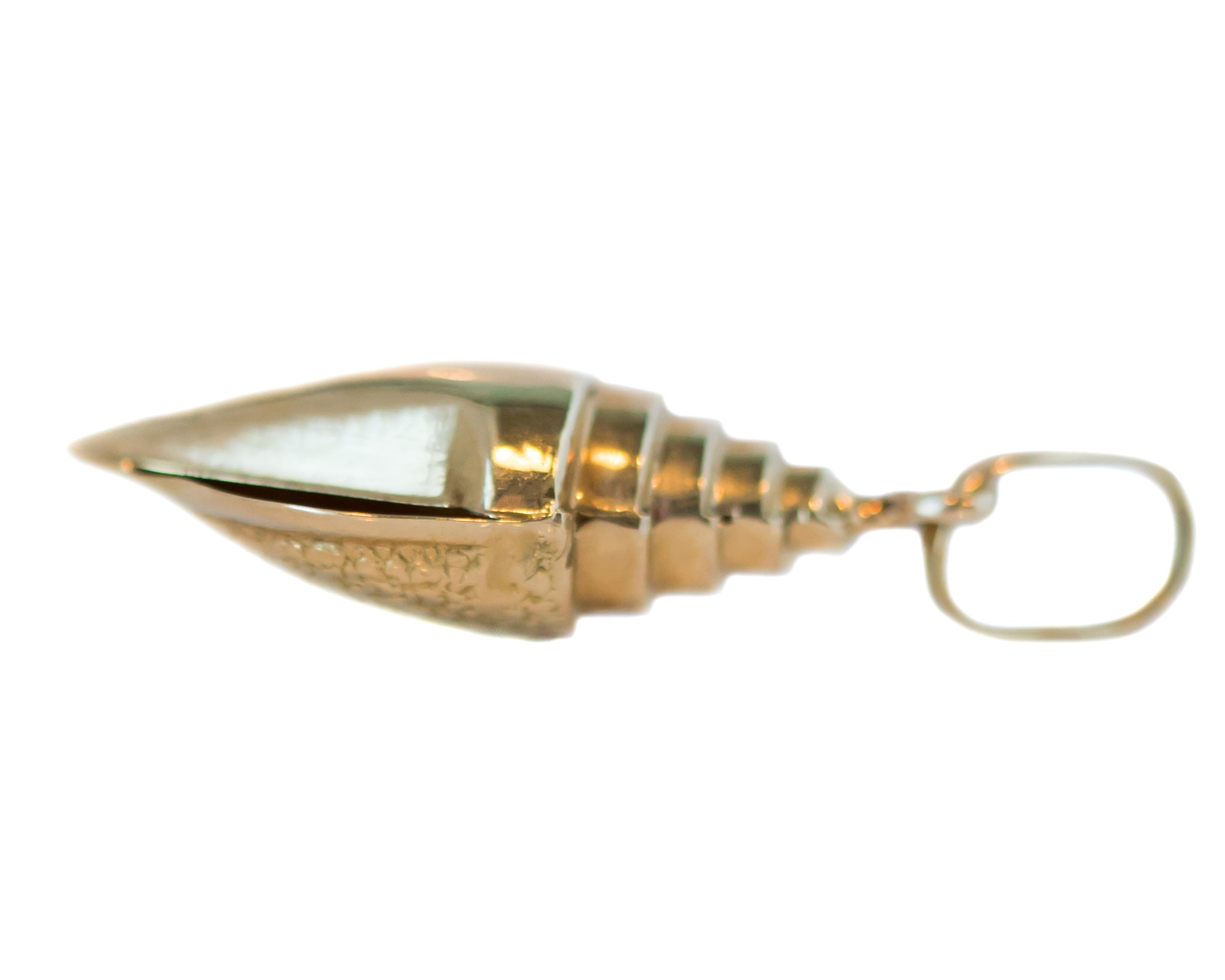 1960s Retro Conch Shell Pendant - 14 Karat Yellow Gold

Features: 
14 Karat Yellow Gold Conch Shell
Sandy Textured outer shell
Spiral Texture Top
Hollow Interior
Generous solid Bail

Shell measures 30 x 10 millimeters
It is 6.5 millimeters