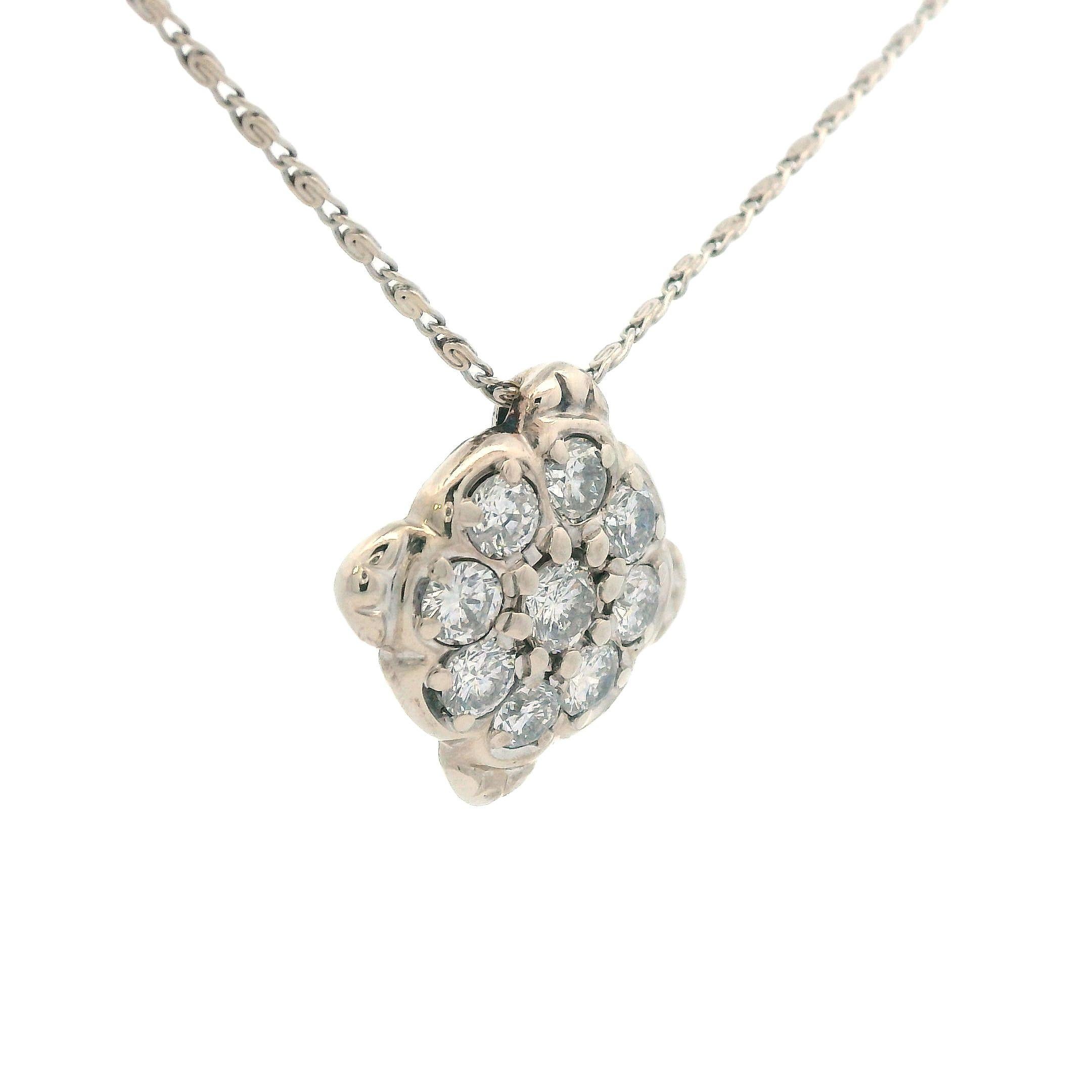 This beautiful necklace from the 1960s features a beautiful 14k white gold diamond cluster pendant. This pendant contains 1.5 carats total of round cut, white, sparkly diamonds. Being made in 14k white gold, this necklace is very durable and wear