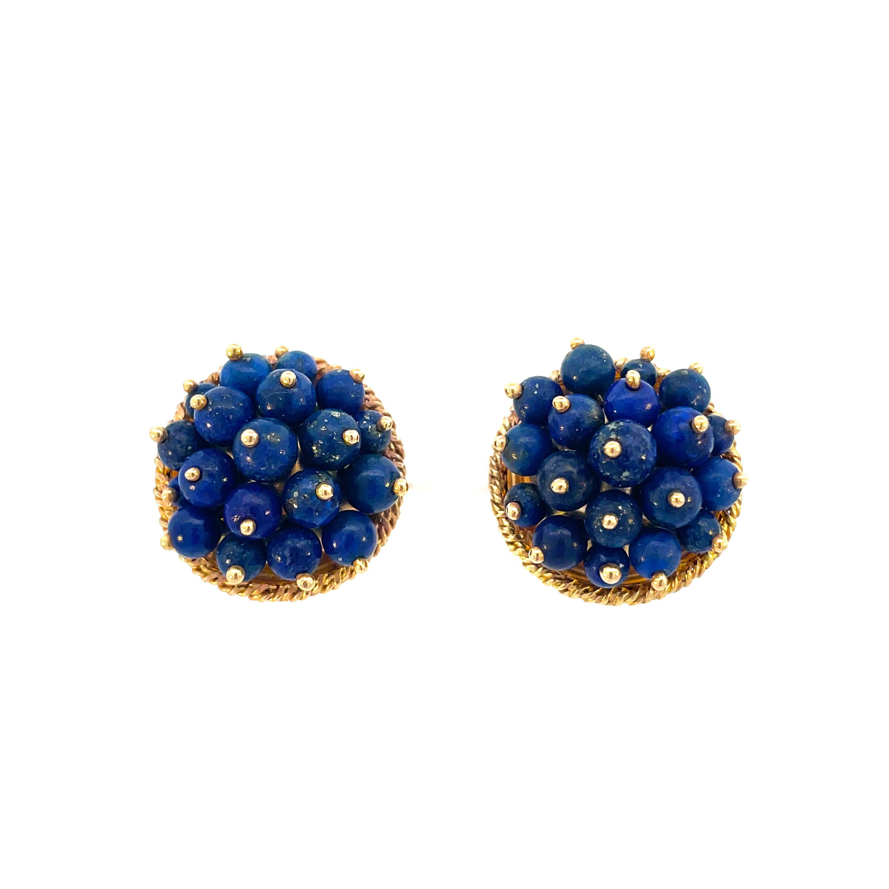 This is a wonderful pair of vintage lever-back earrings, dating to the 1960s, crafted in beaming 14K yellow gold that showcases a collection of vivid blue Lapis beads! These earrings are the perfect pop of color for any outfit for any occasion. The