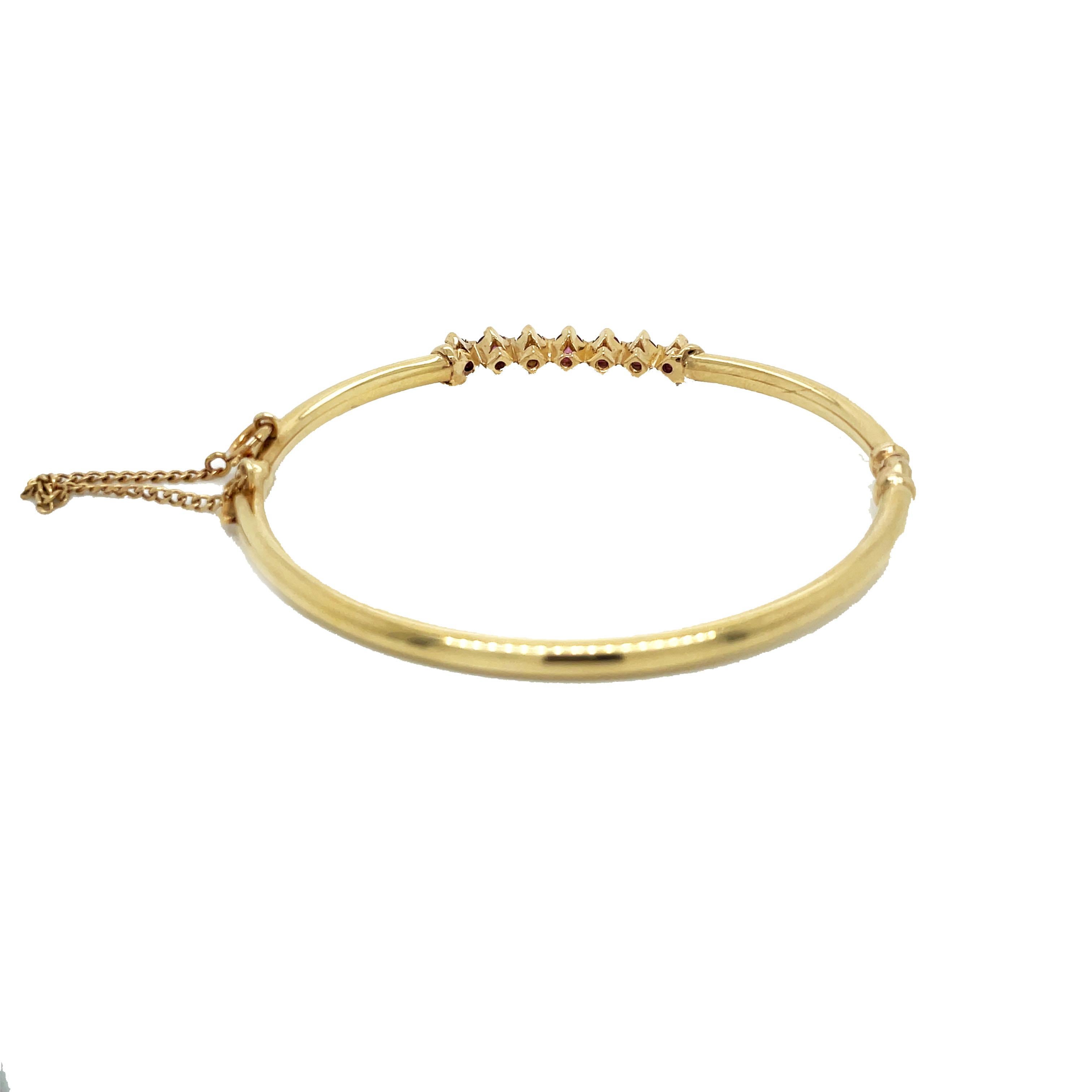 1960s, 14K Yellow Gold Ruby Hinged Bangle In Excellent Condition In Lexington, KY