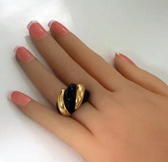 1960s 18 Karat Rose Gold and Black Onyx Swirl Fluted Ring