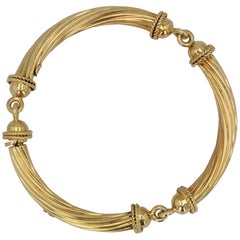 Bracciale Bangle articolato in oro giallo 18 carati del 1960