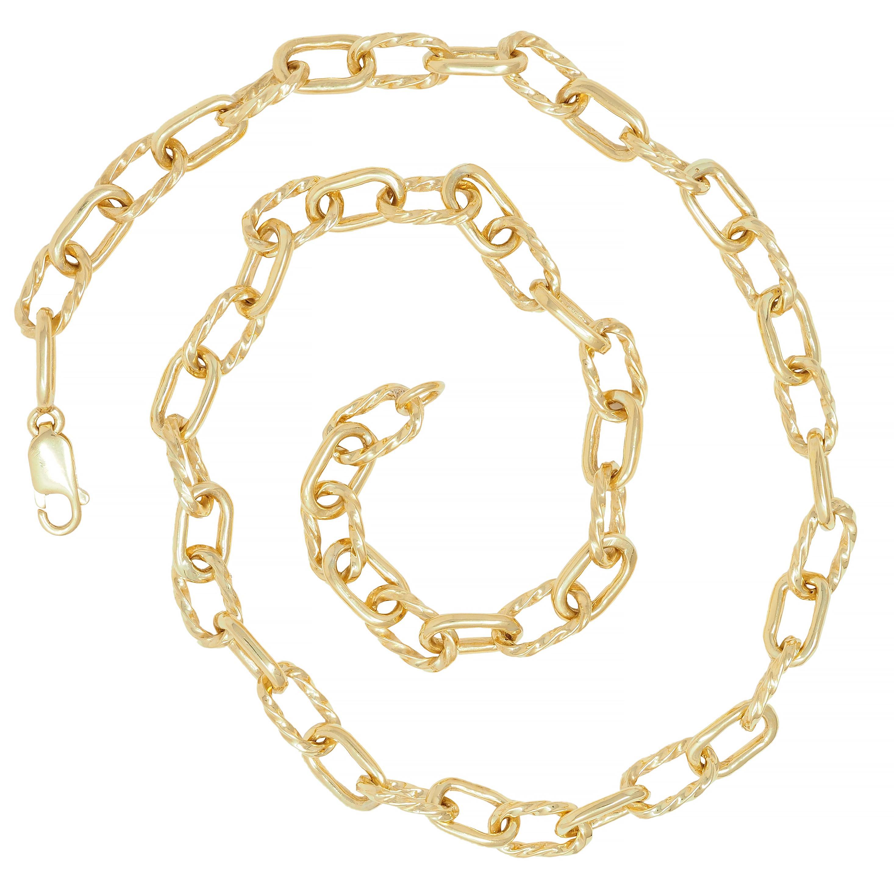Comprised of oval-shaped cable link chain 
Alternating with twisted rope motif links 
With high polish finish
Completed by lobster clasp closure
Stamped for 18 karat gold 
Circa: 1960s
Width at widest: 5/16 inch
Length: 19 inches
Total weight: 55.2
