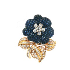 1960s 18K Mystery-Set Sapphire Flower Brooch With Diamond Leaf and Stem