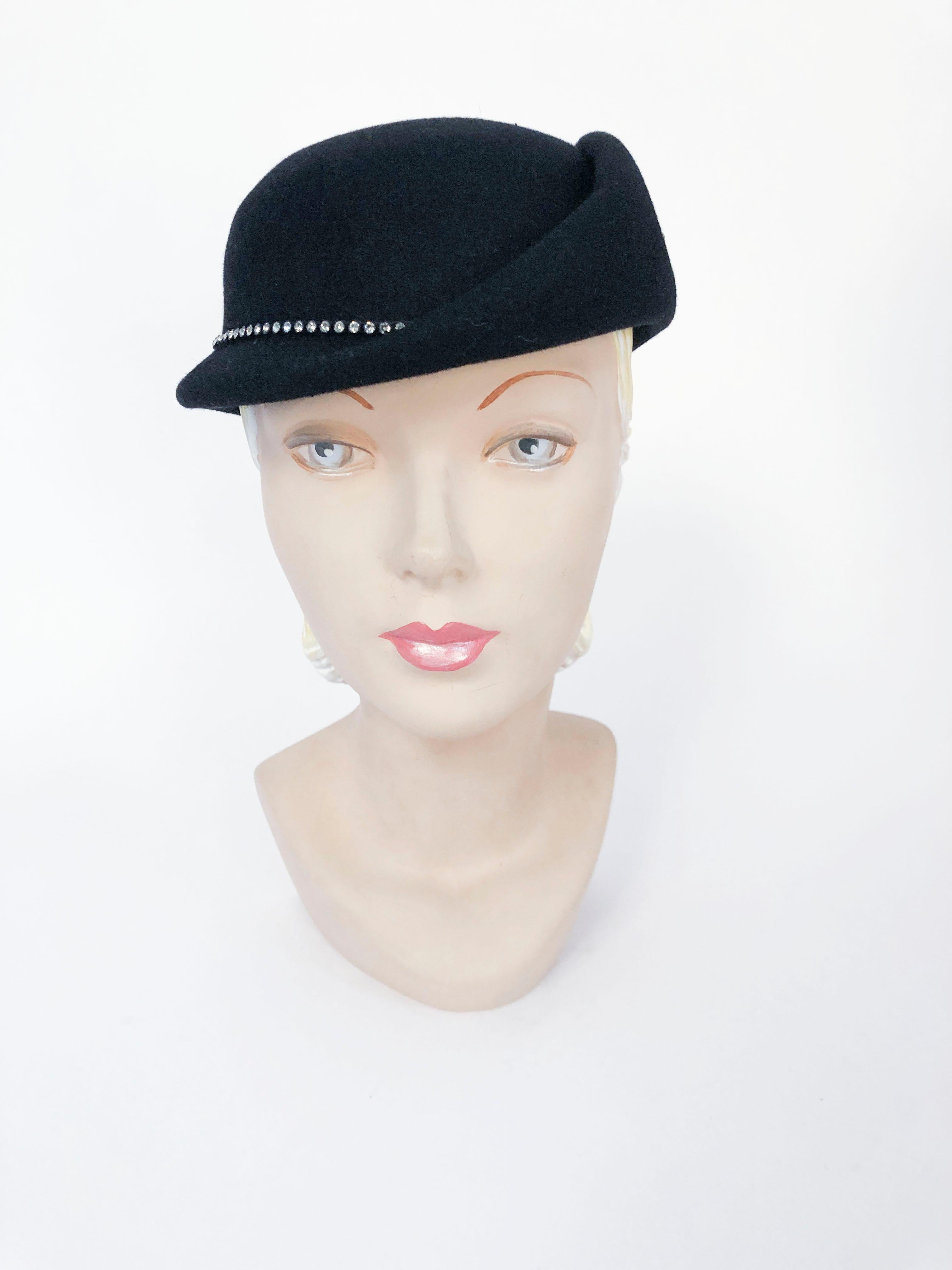 1960s/1970s Black Fur Felt Hat with Rhinestone Accents on the head band and the matching hat pin. This hat mimics the 1930's hat silhouette with its asymetrical shape and brim