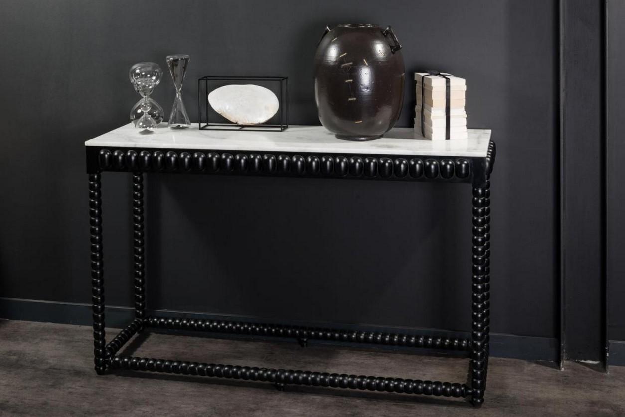 1960s-1970s design style rectangular console table consisting of a graphic and geometric black lacquered wooden feet with a rectangular white marble tray.