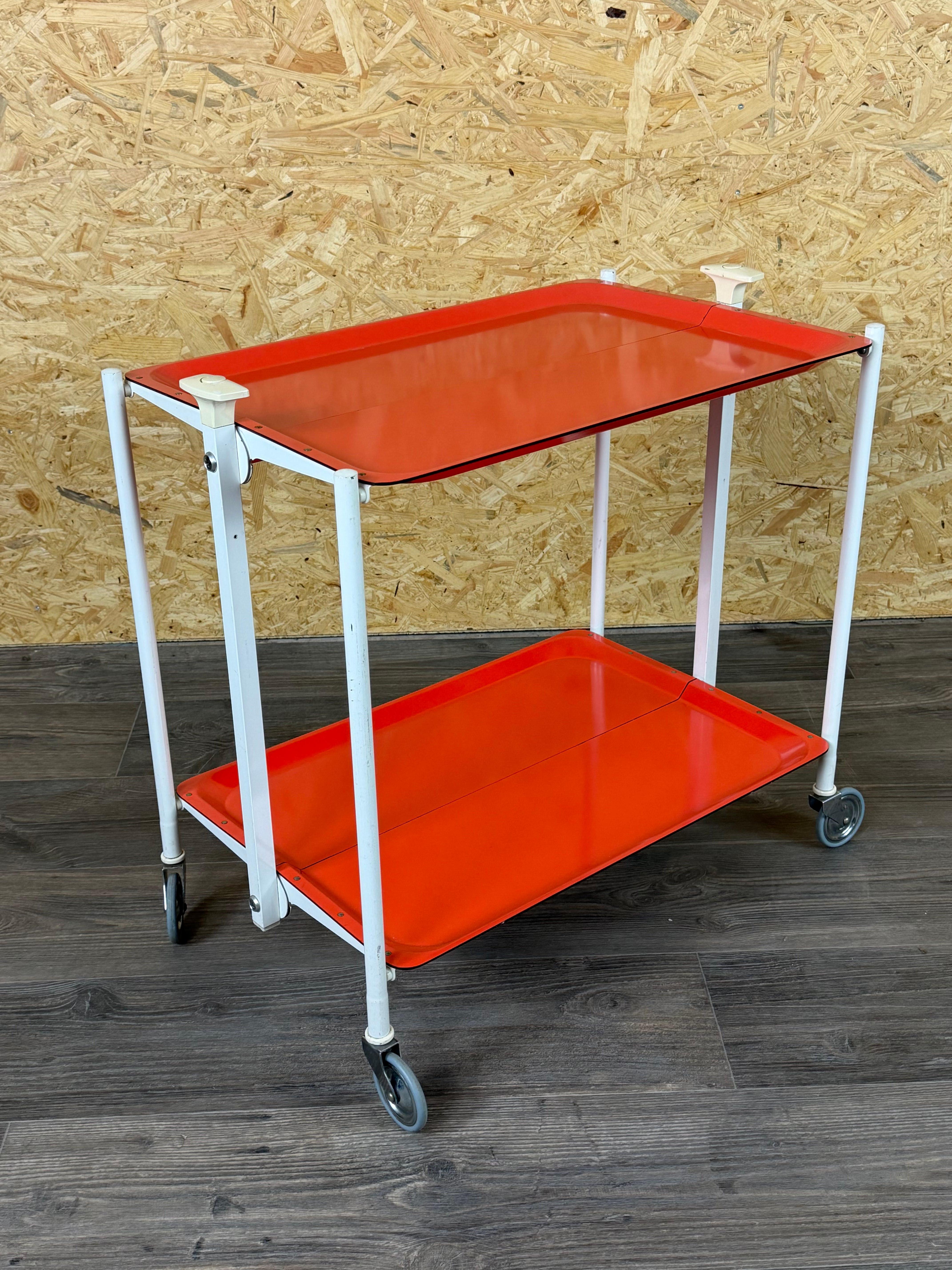 1960s/70s Serving Cart/Dinette Side Table, Orange, Space Age Design

Item: Serving Cart

Manufacturer: Unknown

Condition: Good

Age: Circa 1960-1970

Dimensions:

Width = 67 cm
Depth = 41.5 cm
Height = 65 cm

Material: Metal, Plastic

Other