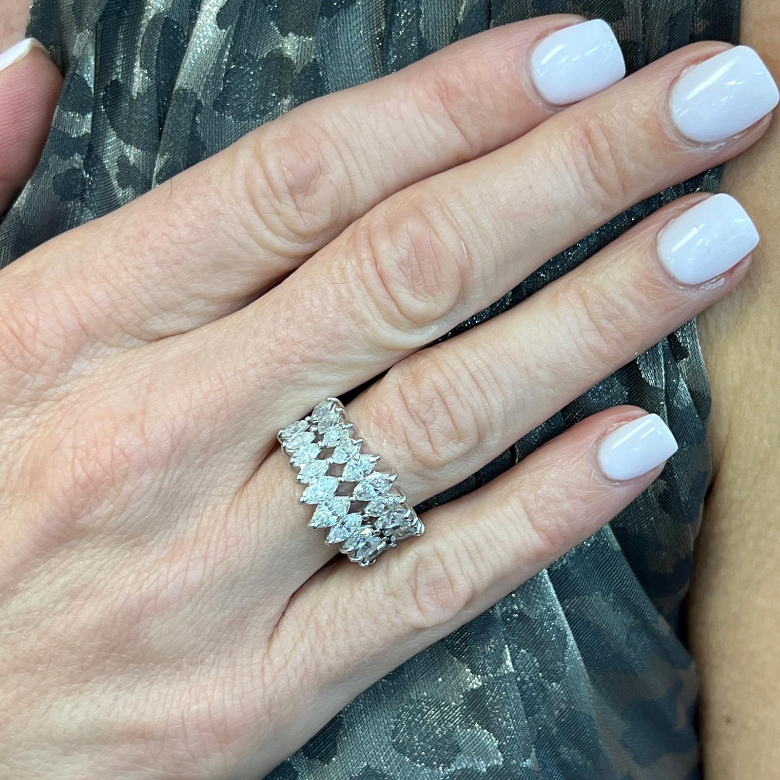 Brilliant marquise diamond vintage wedding band handcrafted in platinum. The ring features 22 marquise shape diamonds weighing approximately 2.00 carat total weight; graded G-I color and SI clarity. The band measures 15mm in width, and is currrently