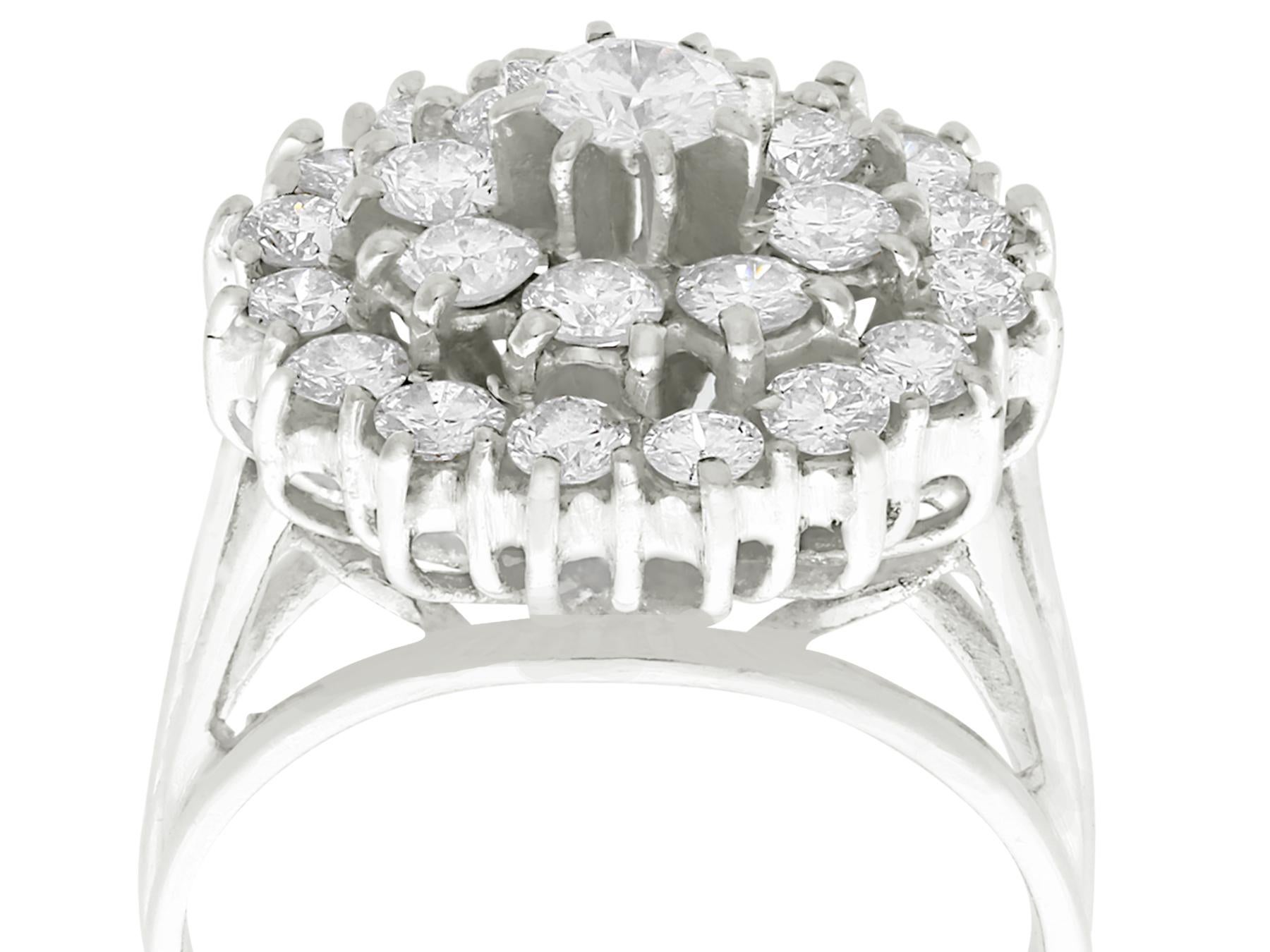 A large and impressive vintage 2.25 carat diamond and 18 karat white gold dress ring; part of our vintage jewelry and estate jewelry collections

This impressive white gold diamond cluster ring has an impressive boat style frame.

The impressive