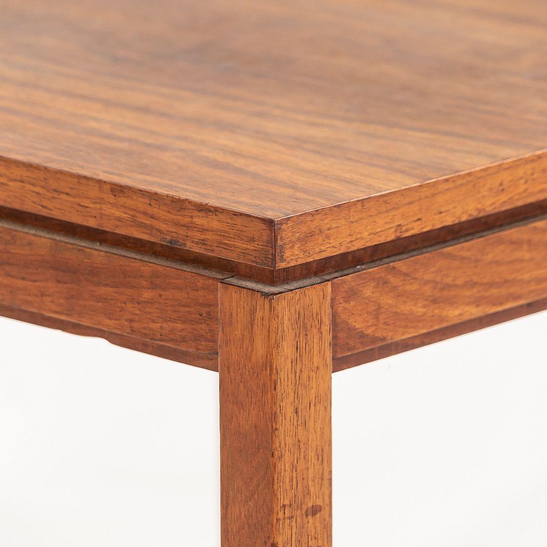 This is a walnut side / end table attributed to Jens Risom, produced in the 1960s. The table features a 30-inch square walnut top with clean lines and a straight-leg base, reflecting Risom's hallmark blend of functionality and modern