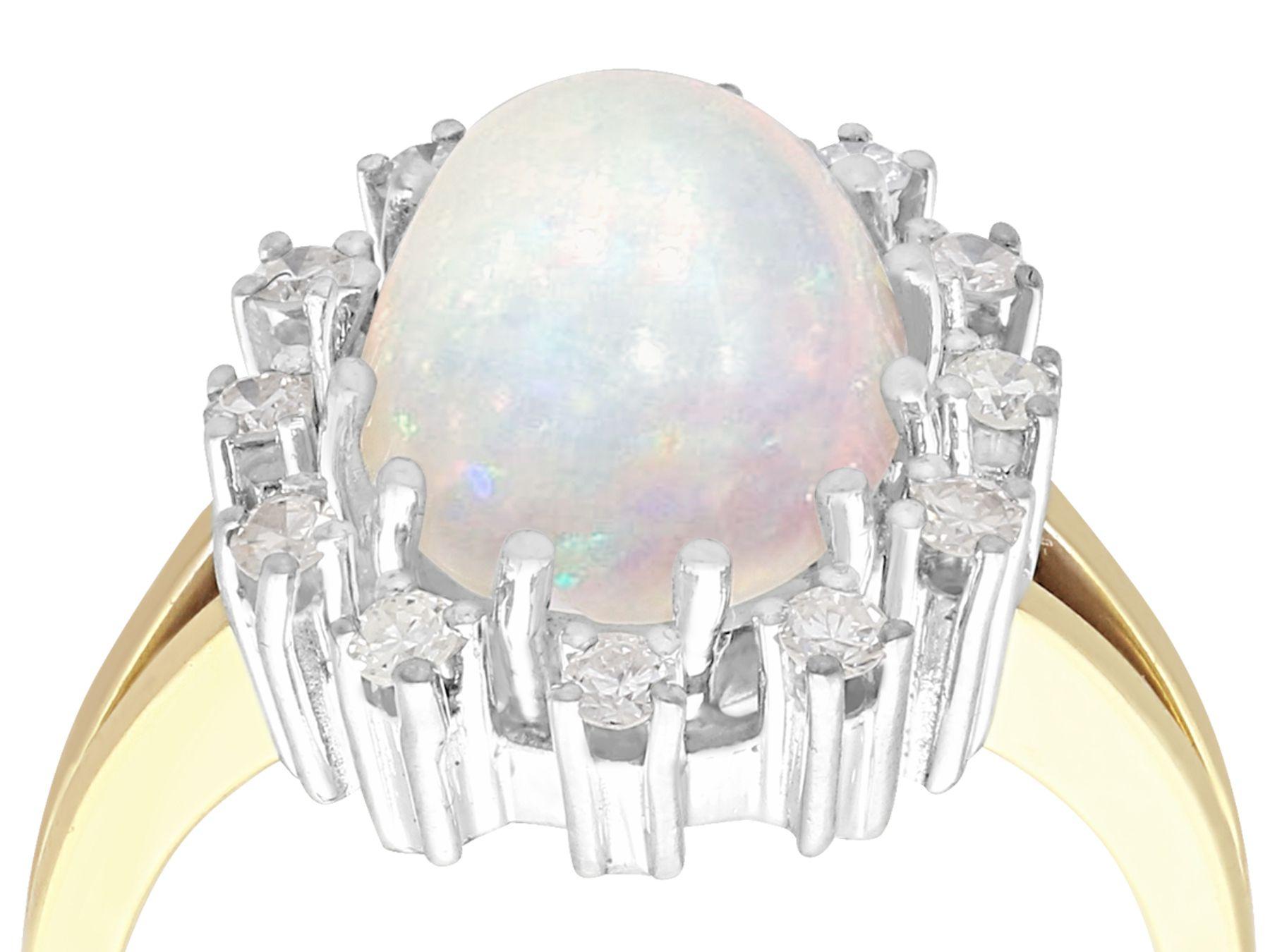 A fine and impressive vintage 3.01 carat opal and 0.38 carat diamond, 14 karat yellow gold and 14 karat white gold set cocktail ring; part of our diverse vintage jewelry collections.

This fine and impressive cabochon cut opal and diamond cluster