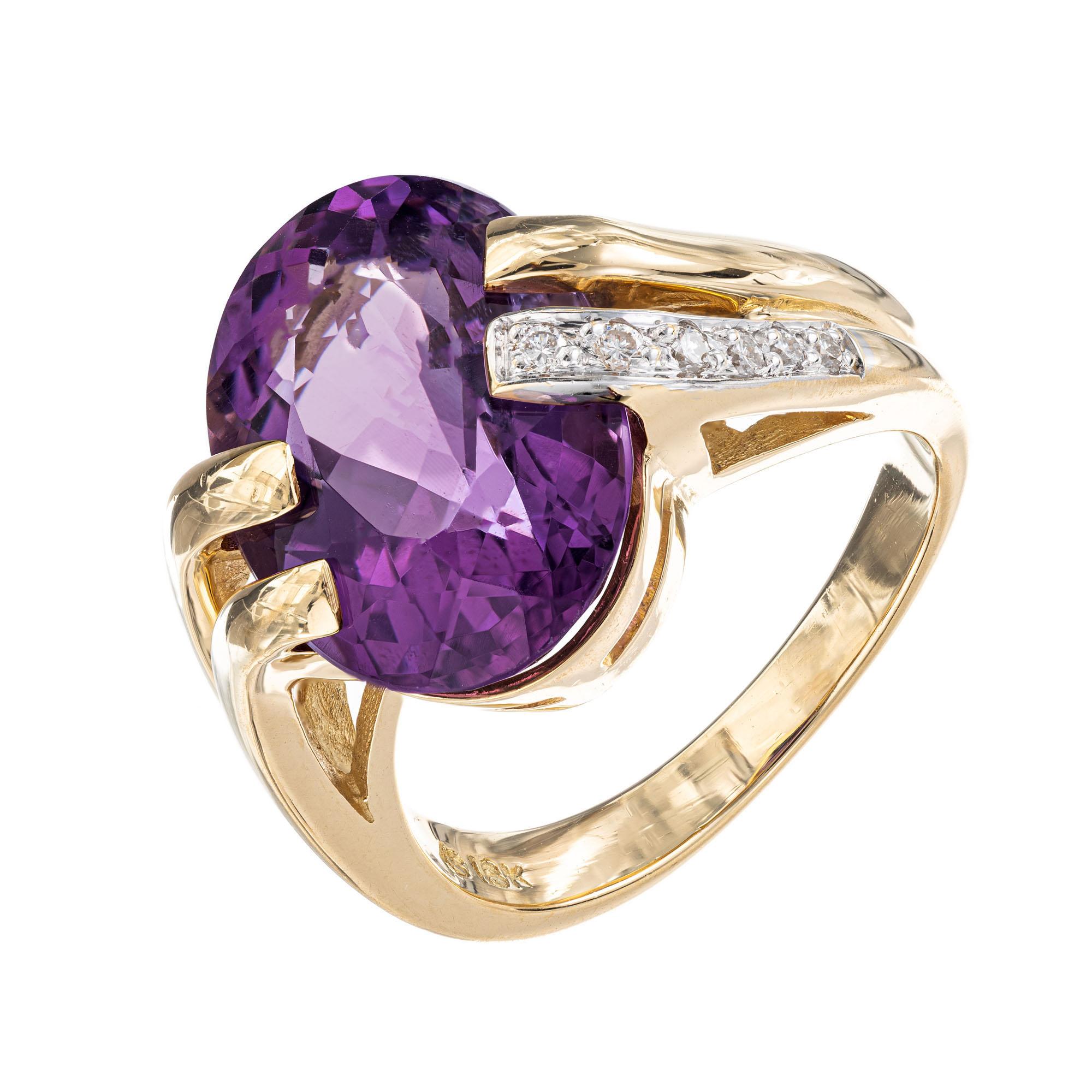 1960's Oval purple and diamond cocktail ring. 6.00ct oval center stone, in an 18k yellow gold swirl setting with 6 round cut diamonds along the shank.

1 oval bright purple Amethyst, approx. total weight 6.00cts, VS, 15.07 x 11.50mm
6 round