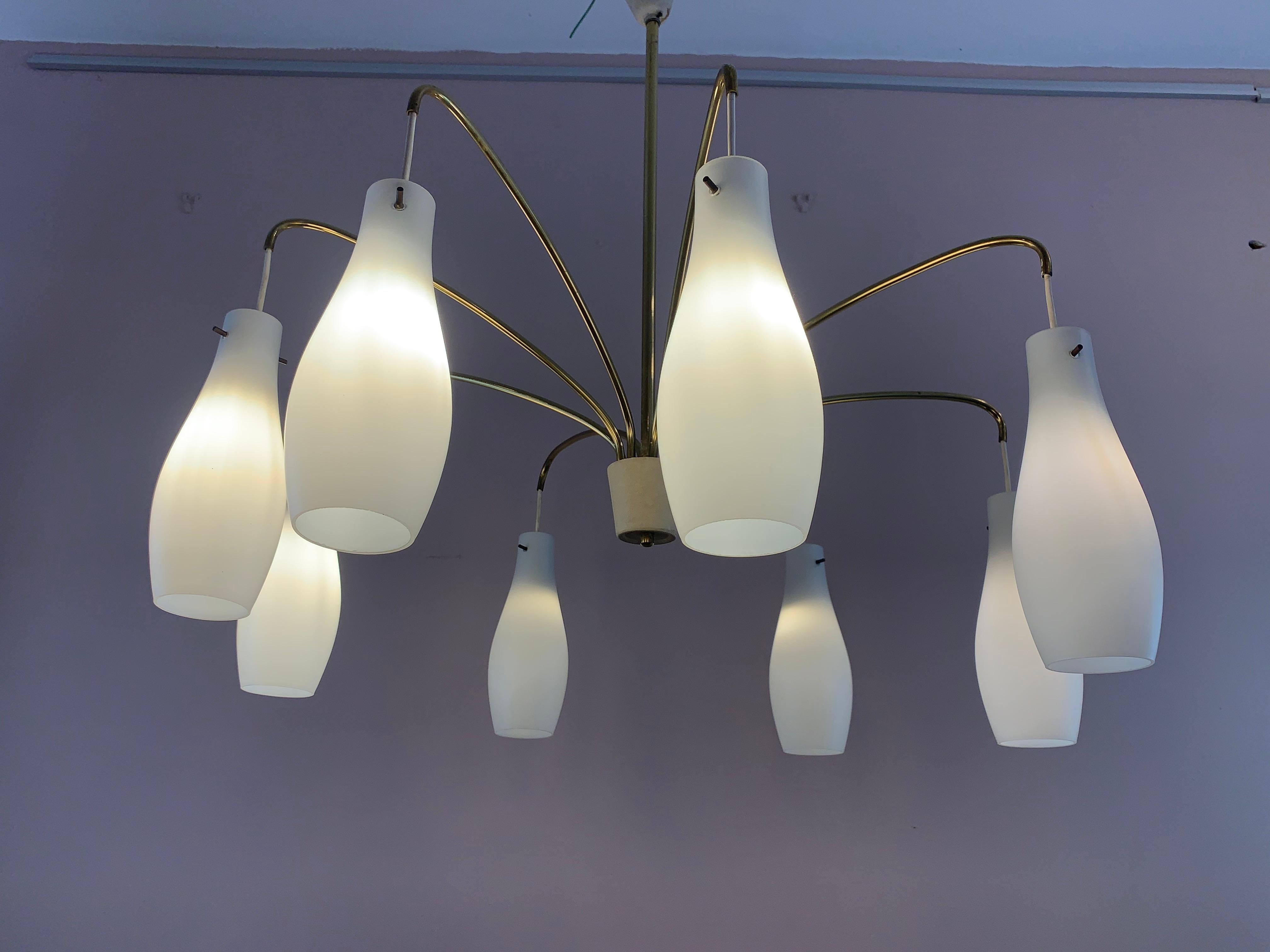 1960s Belgium midcentury 8-arm opaline glass shade hanging light. Each shade is suspended from a brass arm which swivel to ensure each one is equidistant from the other which helps to ensure the light is balanced correctly. The single E14 screw in