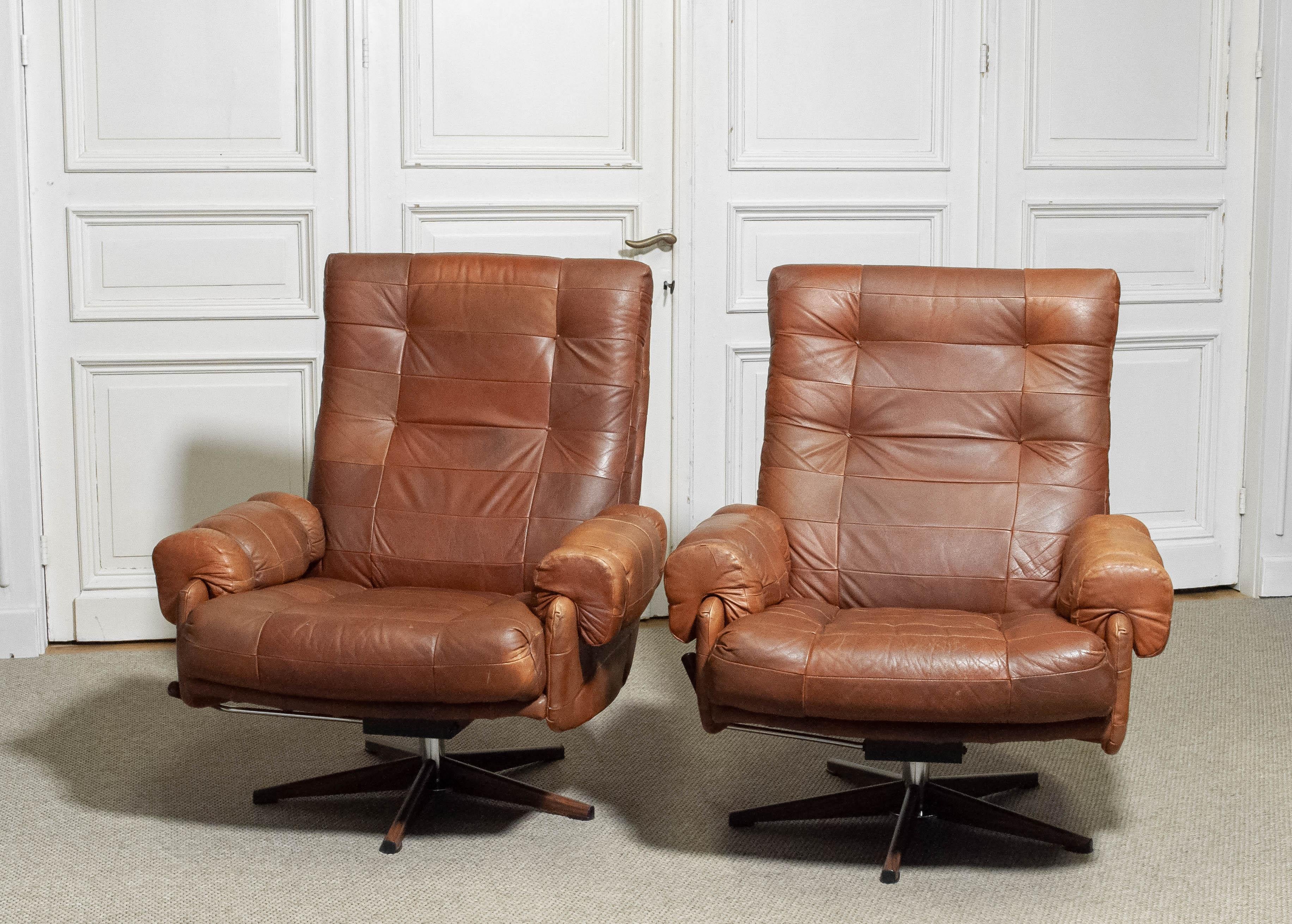 Metal 1960s A Pair of Arne Norell Rocking and Swivel Lounge Chairs Sweden For Sale