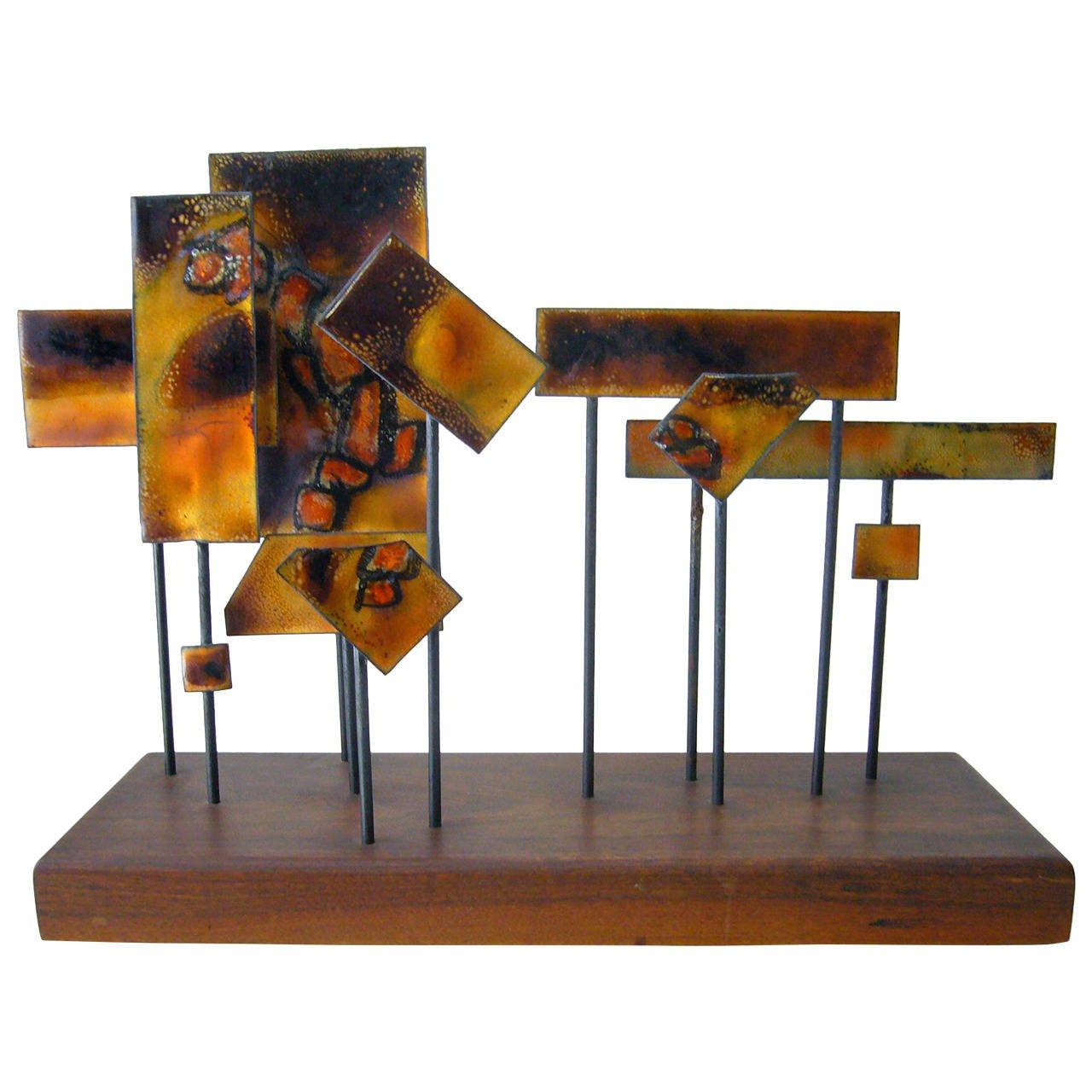 Abstract modern enamel sculpture on walnut base, circa 1960. Sculpture measures 23.5