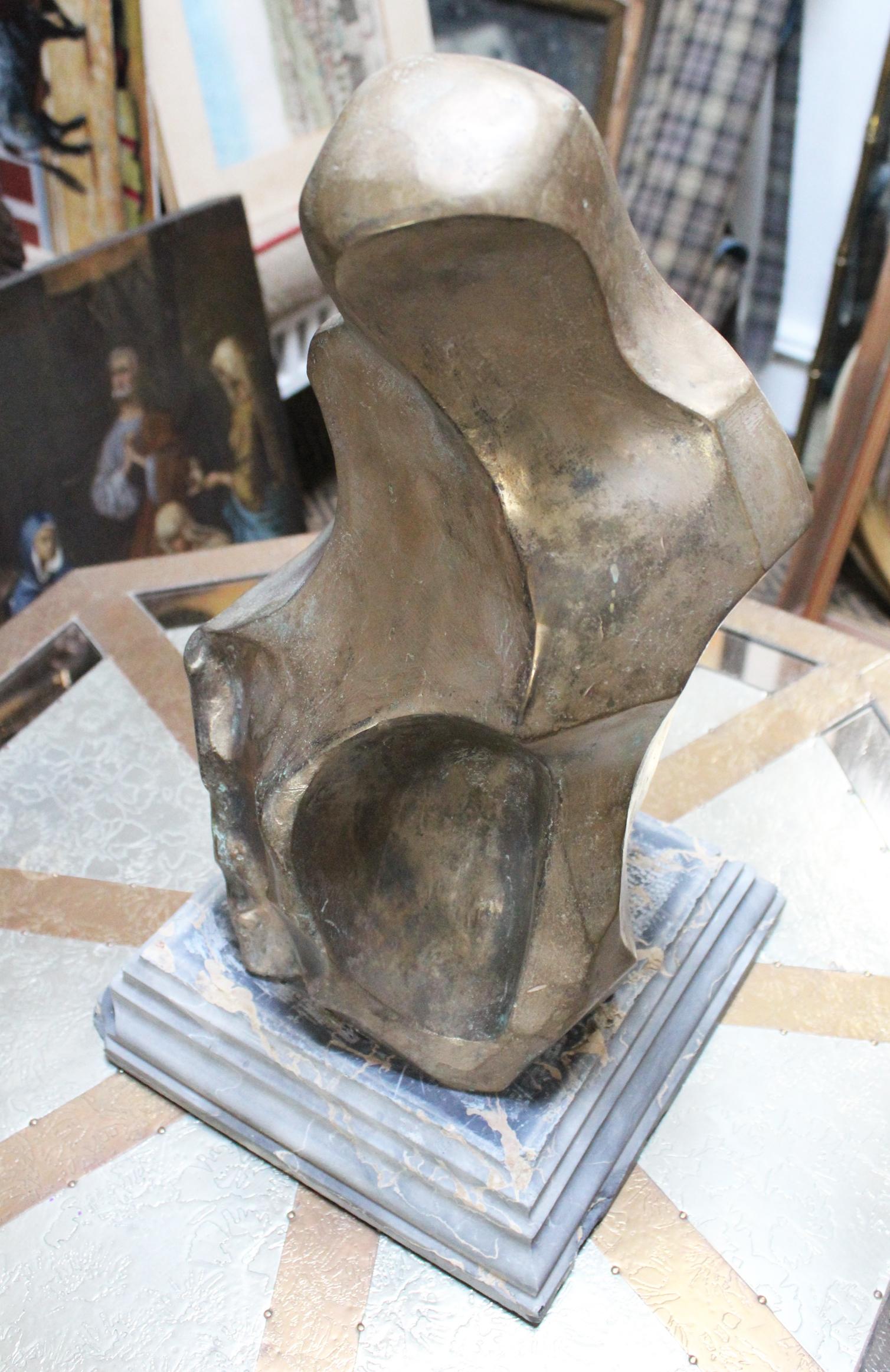 1960s abstract solid bronze sculpture signed by Spanish artist Ana María Nieves representing Jesus Christ on a Nero Portoro marble base. 

Base dimensions: 8 x 25 x 25 cm.