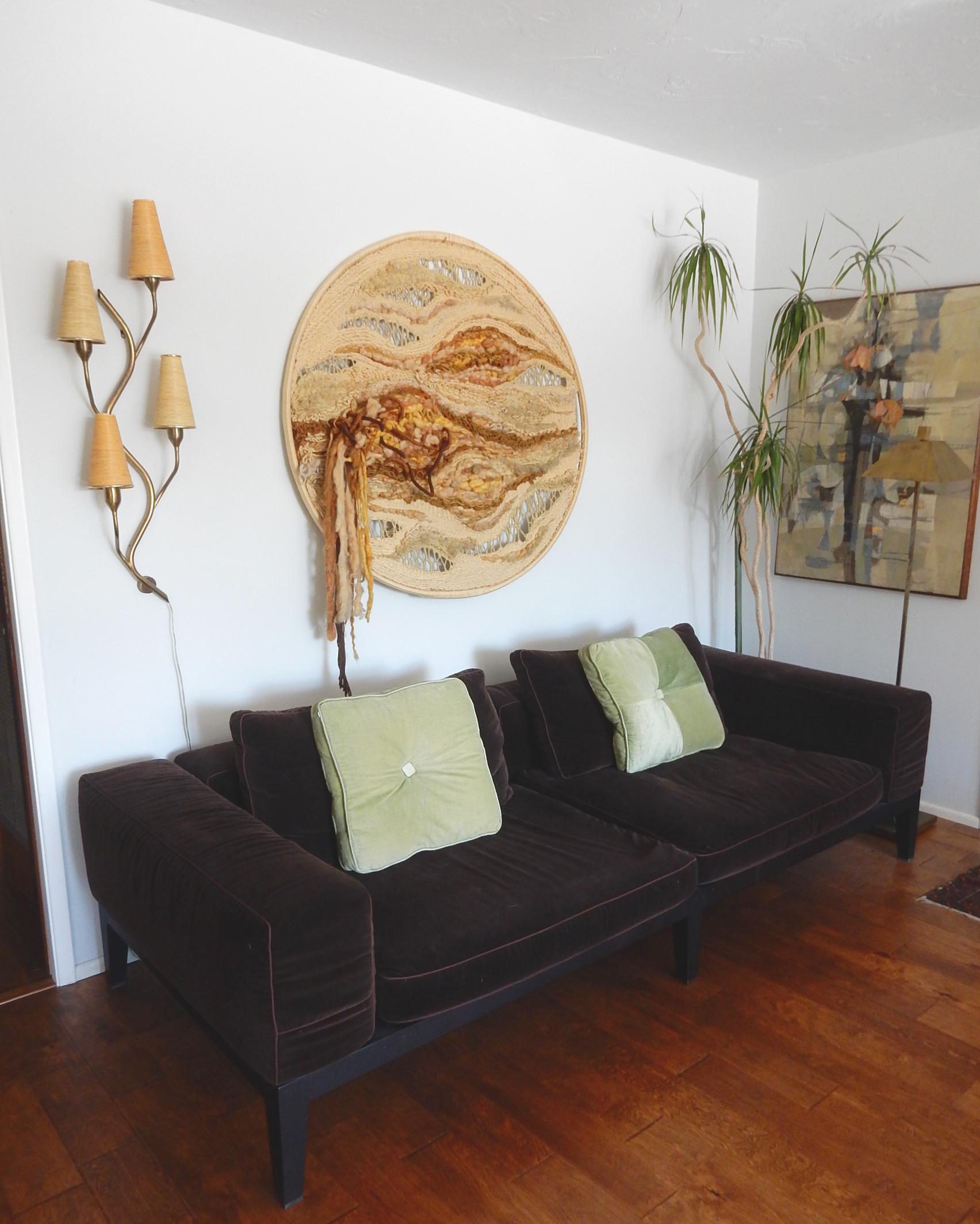 A very large 1960s organic modern abstract wool textile wall art sculpture.
Hand woven on a bent wood hoop.
Exceptional work of art in the extraordinary style of Sheila Hicks
Measures 4 feet across and 44 inch tall.
Not signed.