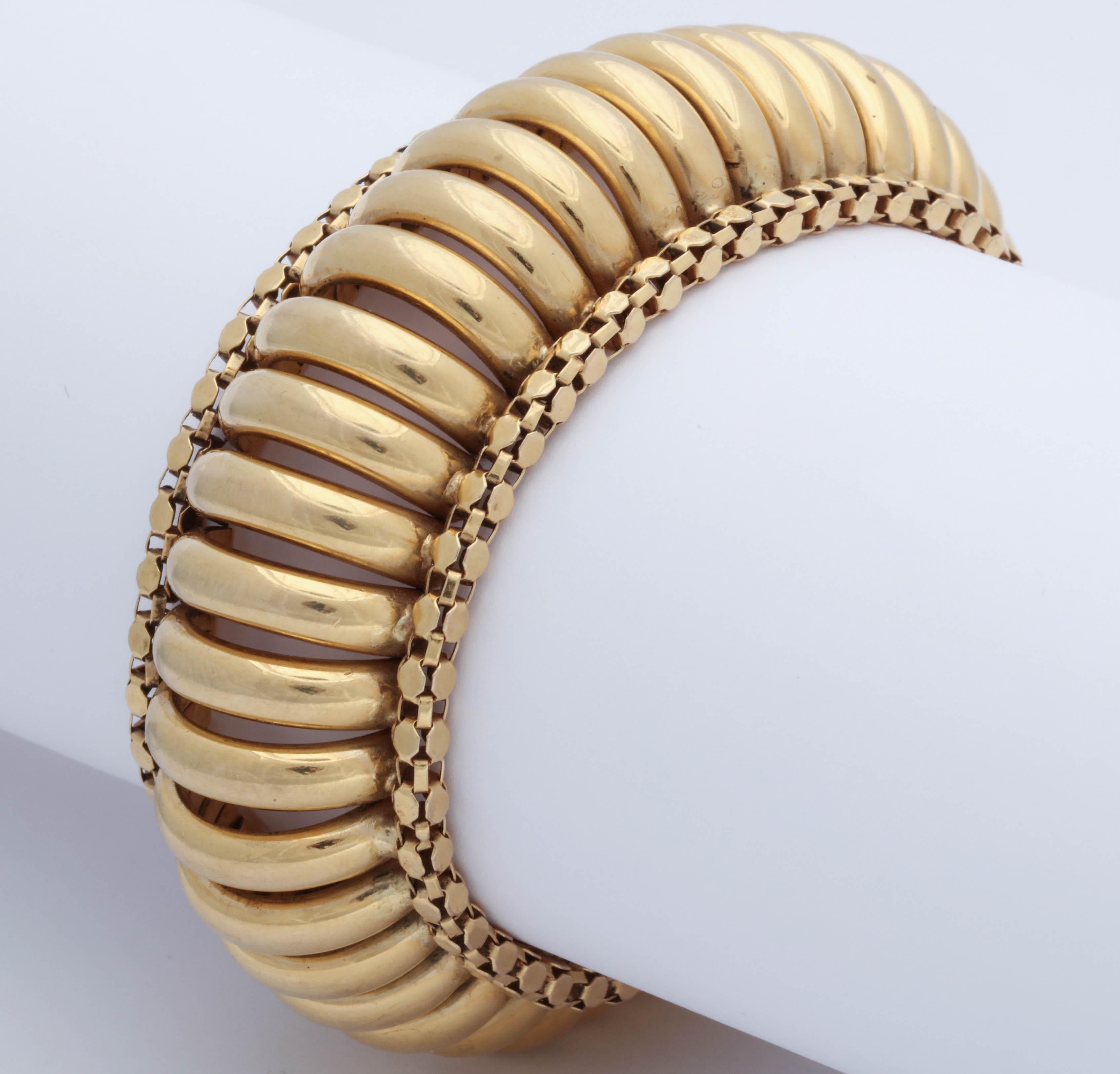 One 18kt  Yellow Gold Accordion Design Flexible Link Bracelet When Worn Has A Dramatic Bold Large Bangle Effect. Created In The 1960's In The United states Of america.