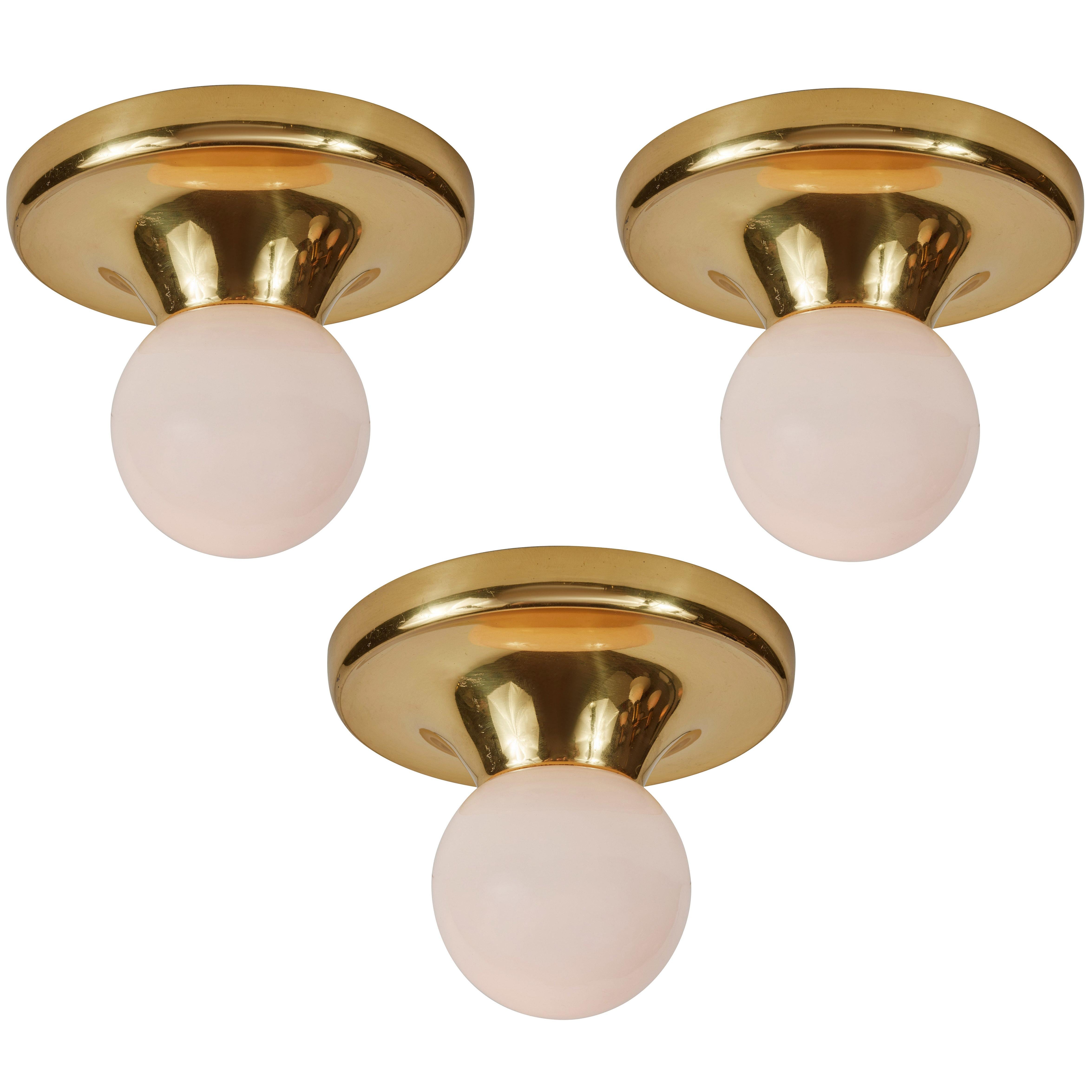 1960s Achille Castiglioni 'Light Ball' wall or ceiling lamp for Flos. Designed in 1965, this rare and vintage brass variant comes with satin opaque glass. An incredibly refined and iconic midcentury design that is quintessentially Italian. This