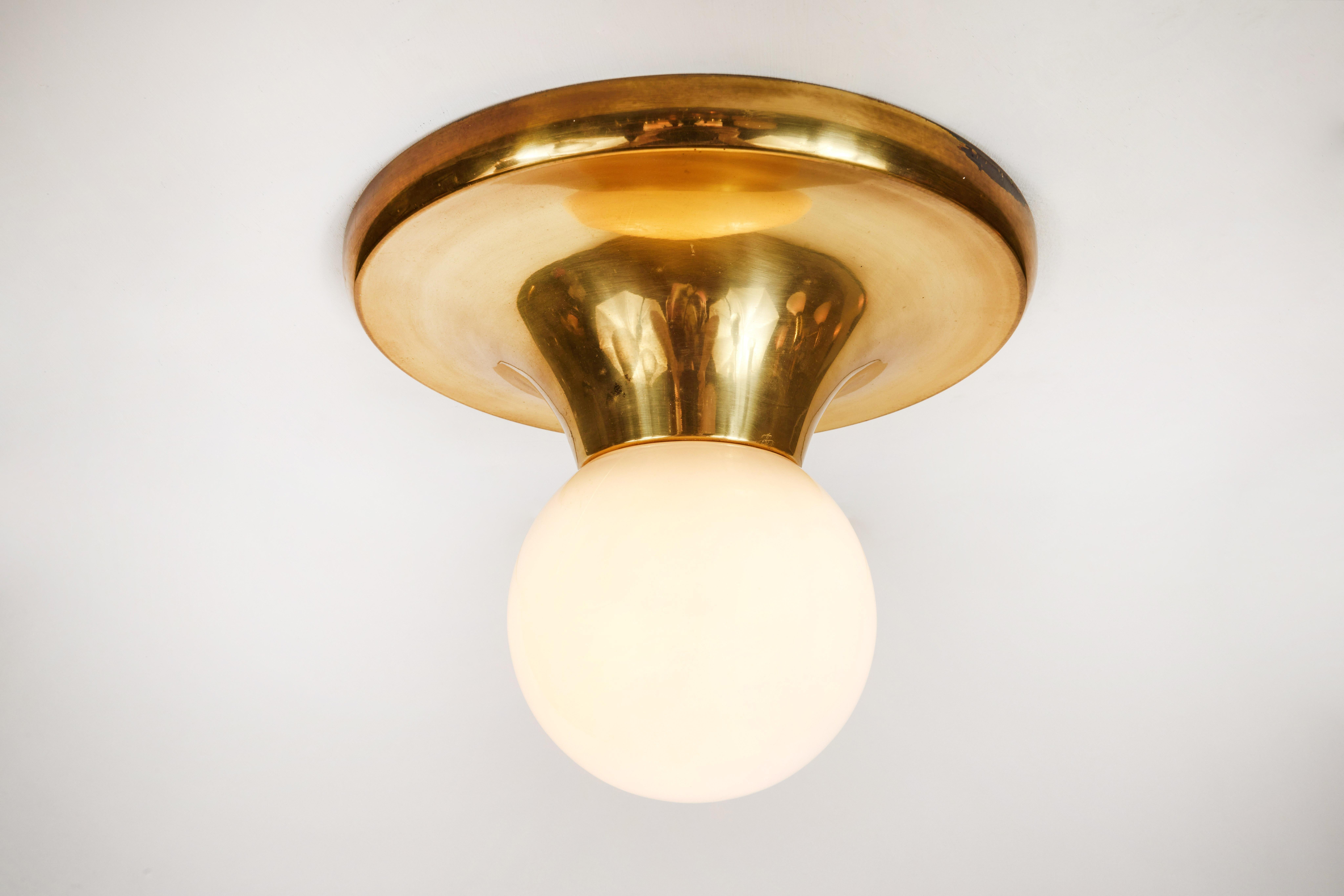 1960s Achille Castiglioni & Pier Giacomo 'Light Ball' Wall or Ceiling Lamp for Flos. Designed in 1965, this rare and vintage brass variant comes with opaque glass. An incredibly refined and iconic midcentury design that is quintessentially Italian.
