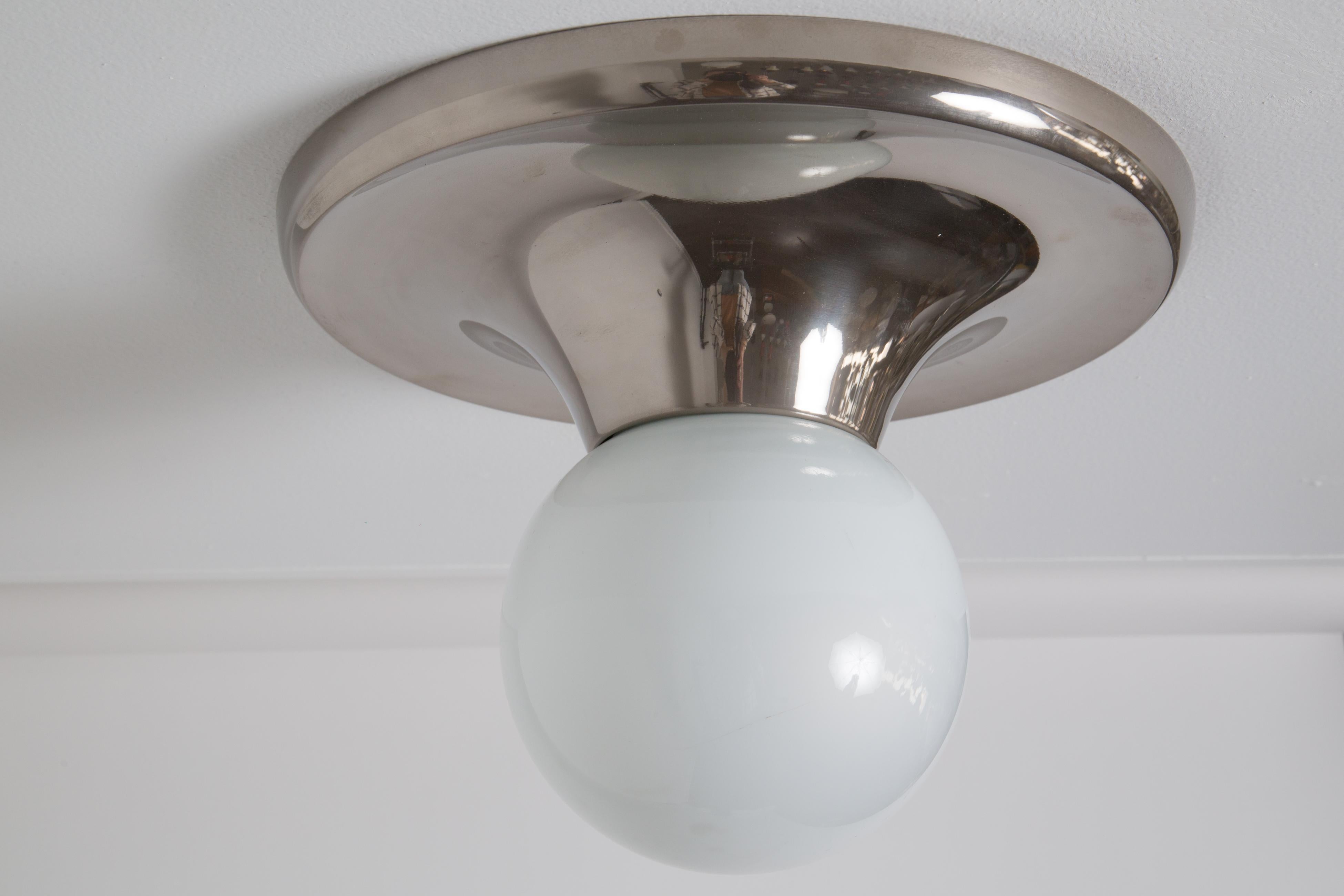 1960s Achille Castiglioni Nickel 'Light Ball' wall or ceiling lamp for Flos. Designed in 1965, this rare and vintage nickel plated brass variant comes with satin opaque glass. An incredibly refined and iconic midcentury design that is