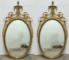 1960s Adam Style Silver / Gold Giltwood Oval Mirrors  Att. Friedman Bros, Pair
