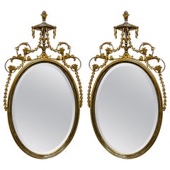 1960s Adam Style Silver / Gold Giltwood Oval Mirrors  Att. Friedman Bros, Pair